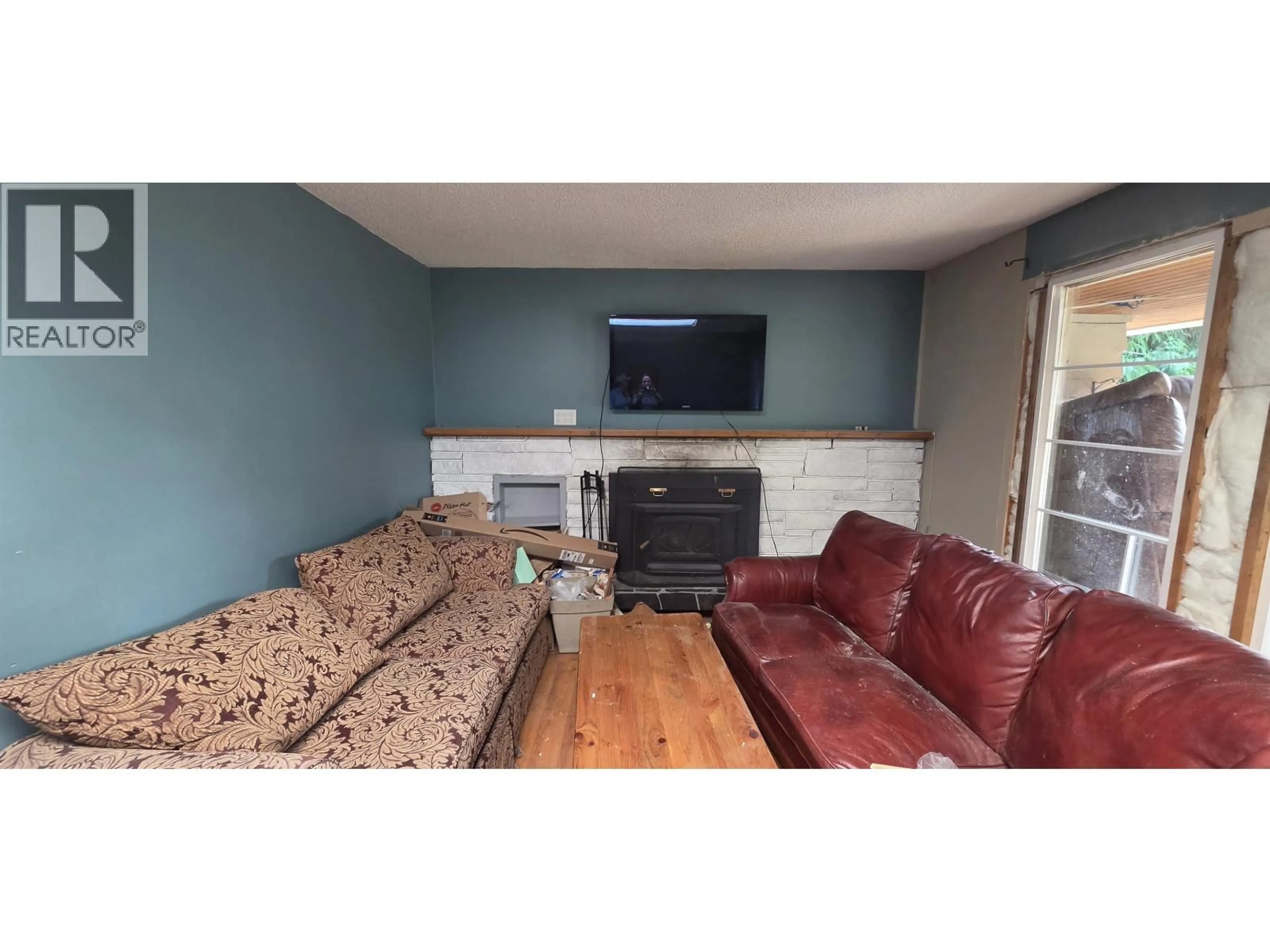Living room with furniture, wood/laminate floor for 12888 FRONT ROAD, Madeira Park British Columbia V0N2H1