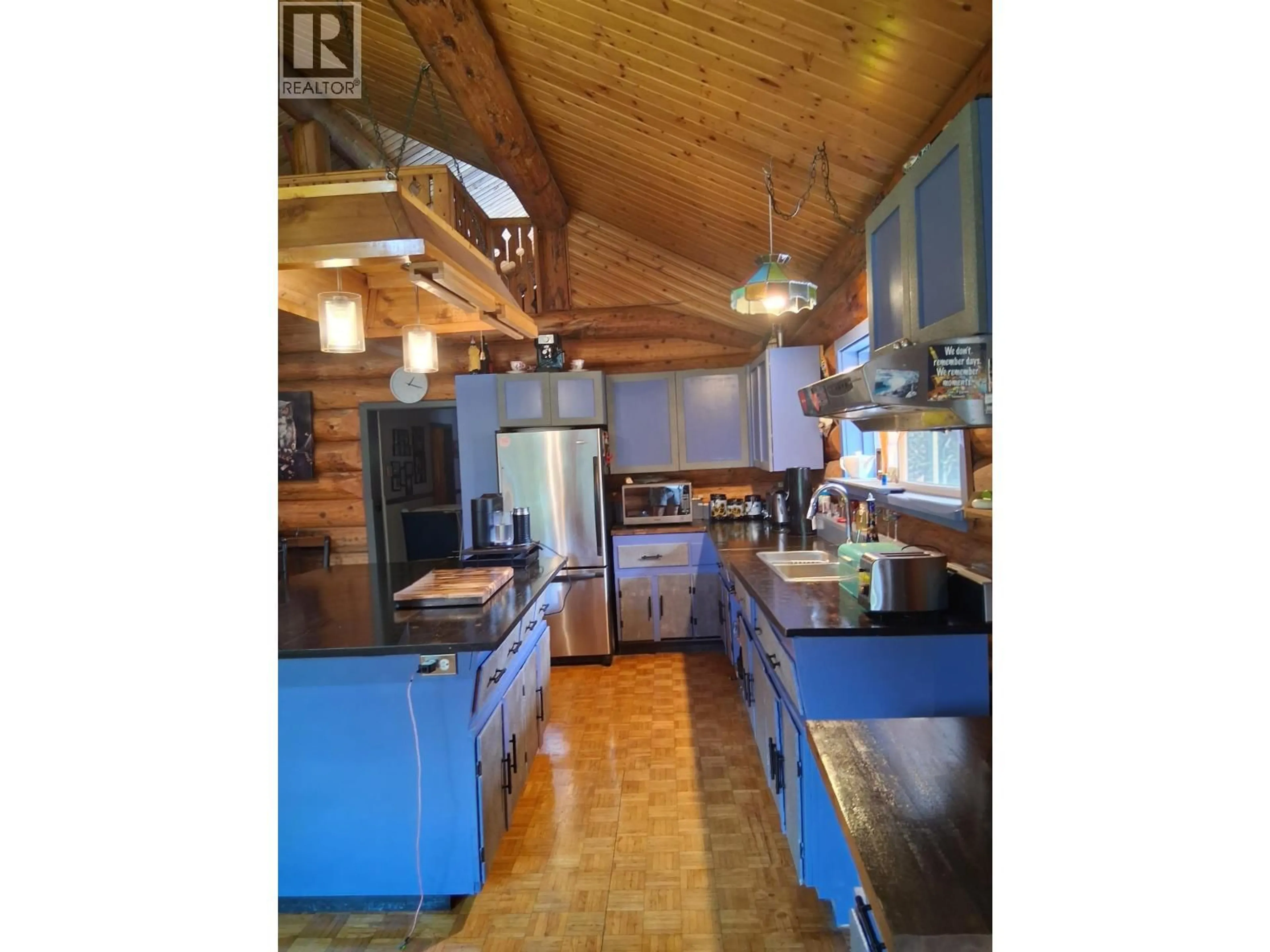 Open concept kitchen, wood/laminate floor for 24014 16 HIGHWAY, Smithers British Columbia V0J2N0