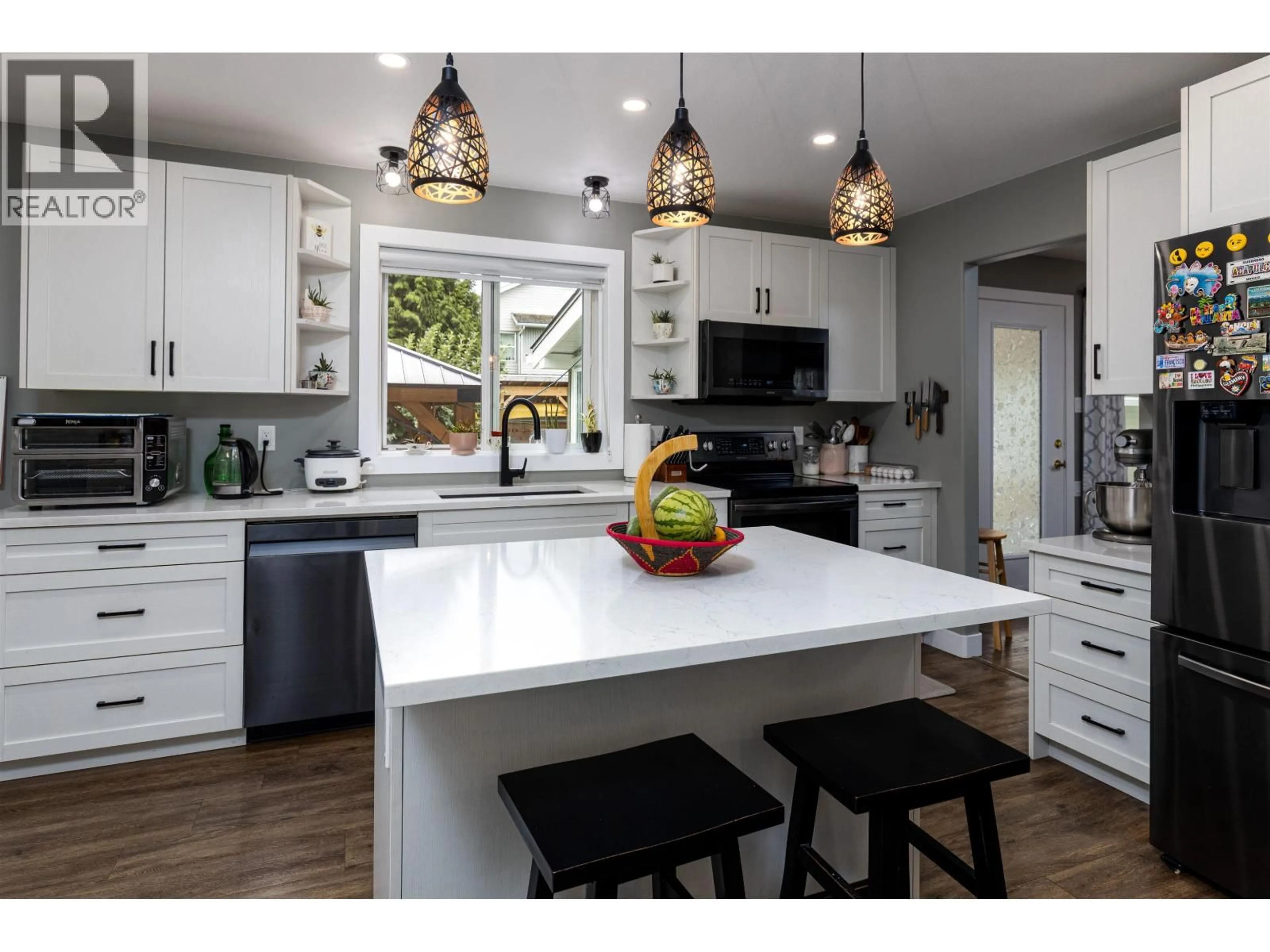 Open concept kitchen, wood/laminate floor for 4819 PARK AVENUE, Terrace British Columbia V8G1W3