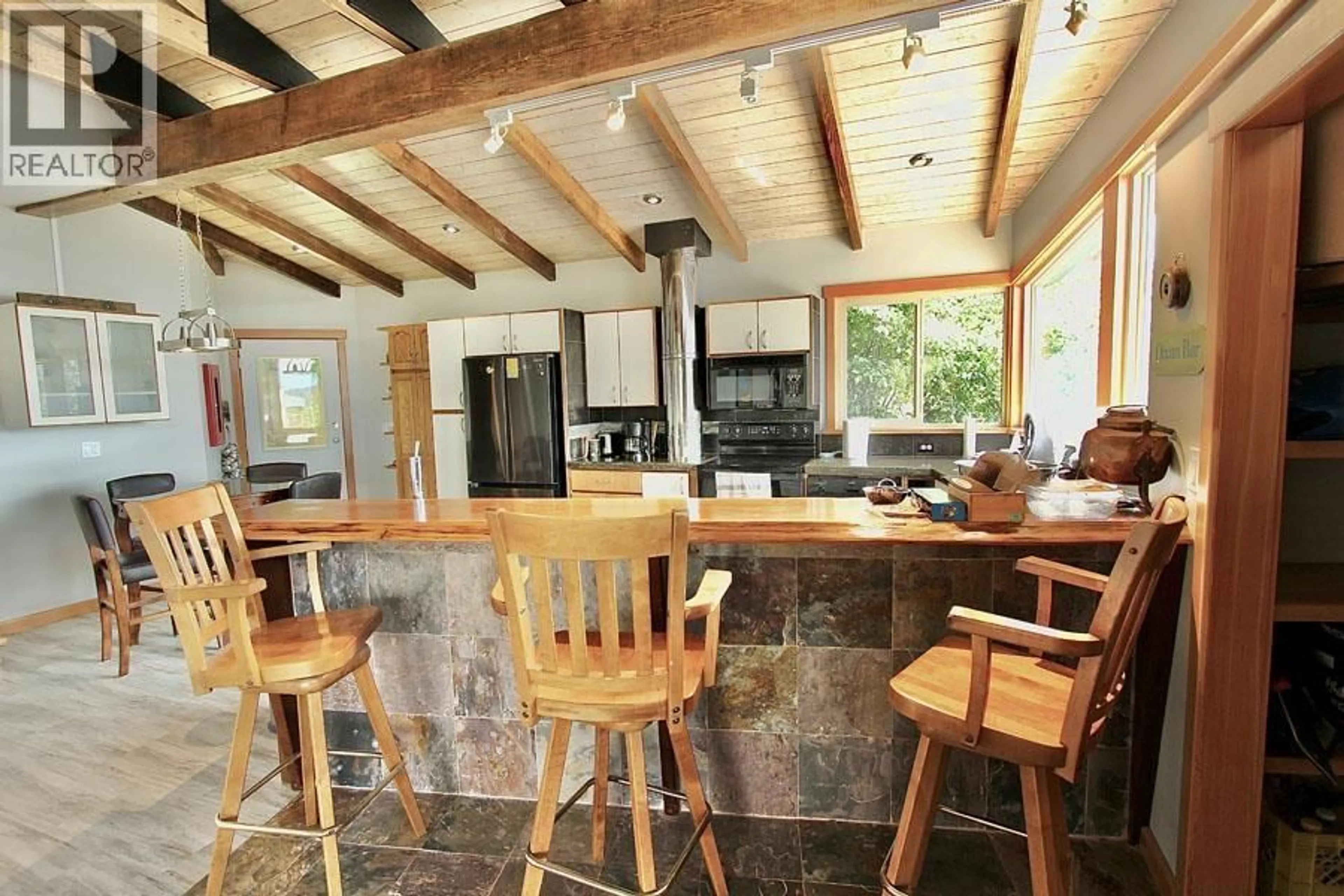 Rustic kitchen, ceramic/tile floor for 3409 OCEANVIEW DRIVE, Daajing Giids City British Columbia V0T1S0