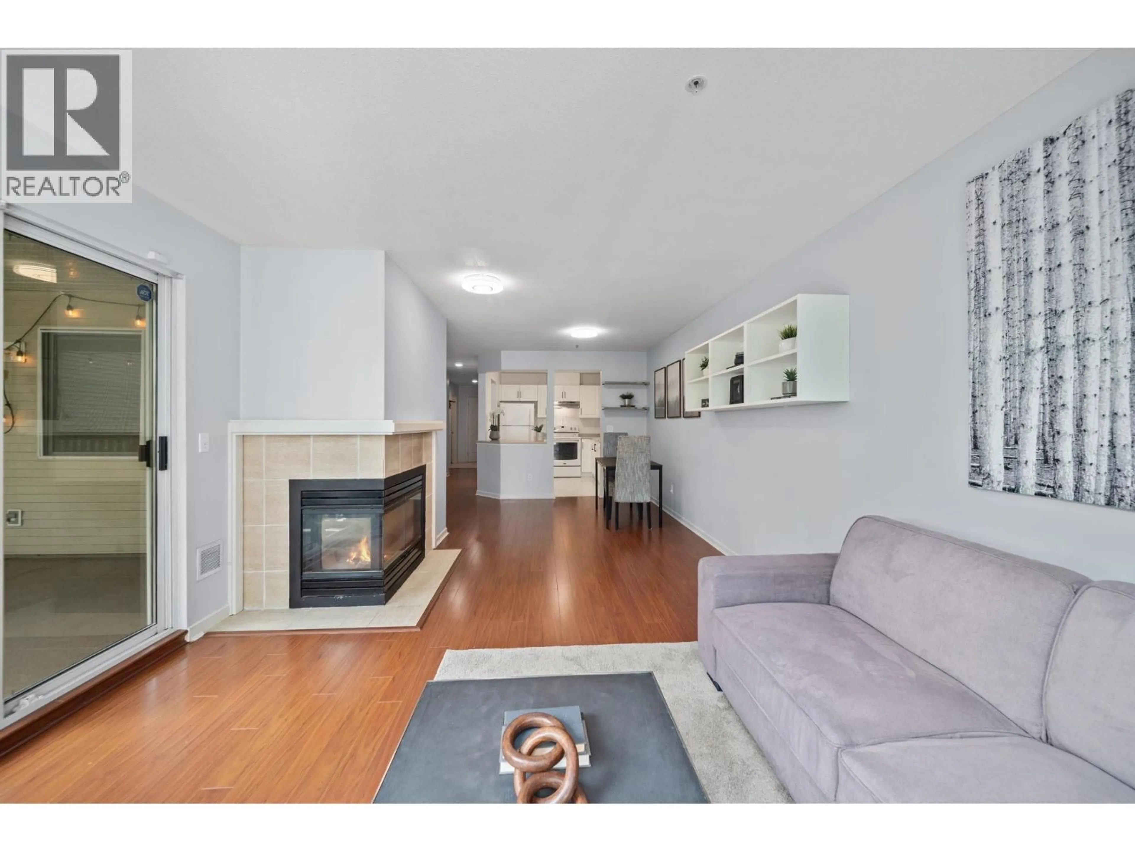 Living room with furniture, wood/laminate floor for 401 - 22233 RIVER ROAD, Maple Ridge British Columbia V2X3N7
