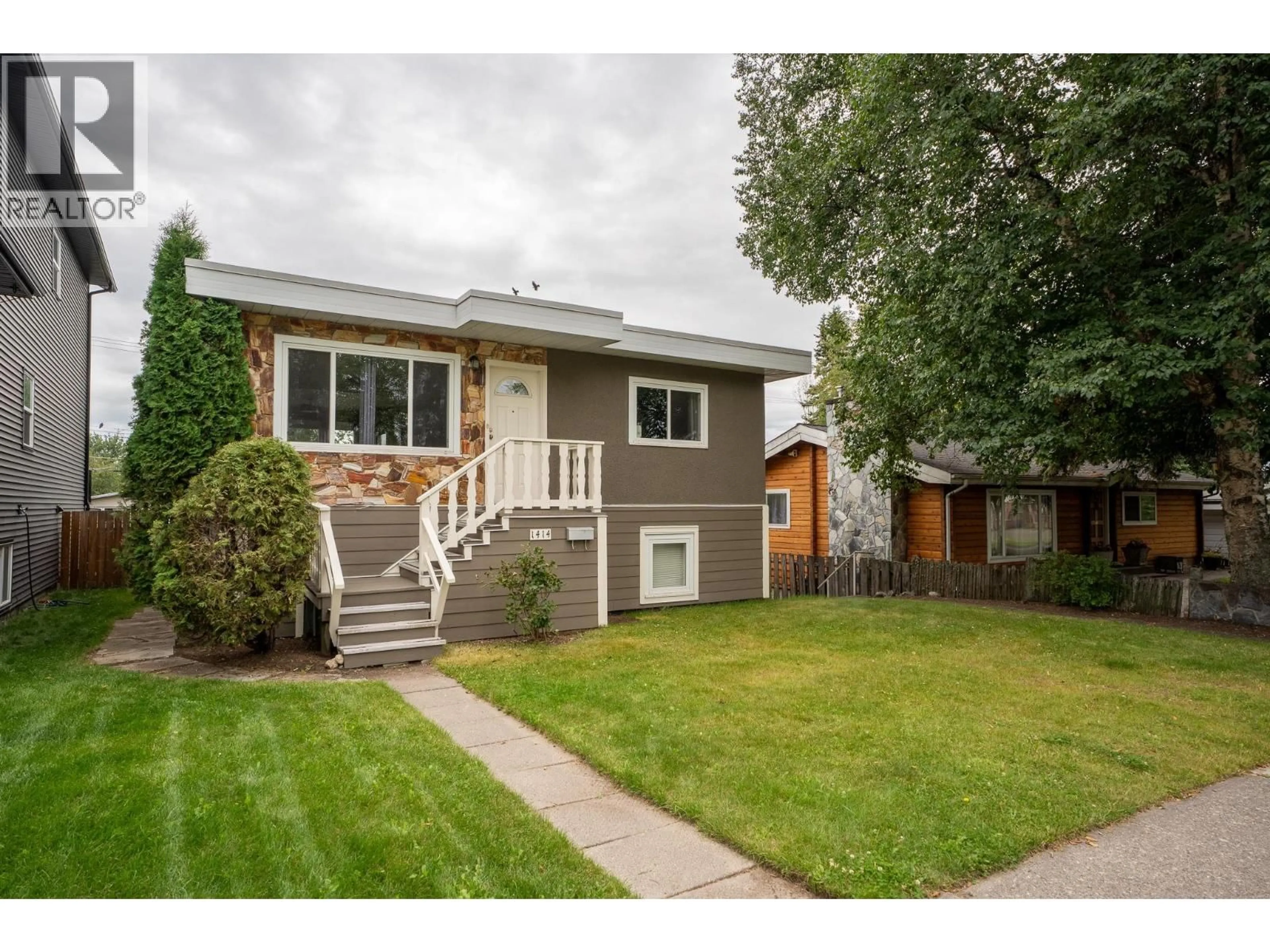 Home with vinyl exterior material, street for 1414 FREEMAN STREET, Prince George British Columbia V2M2R8