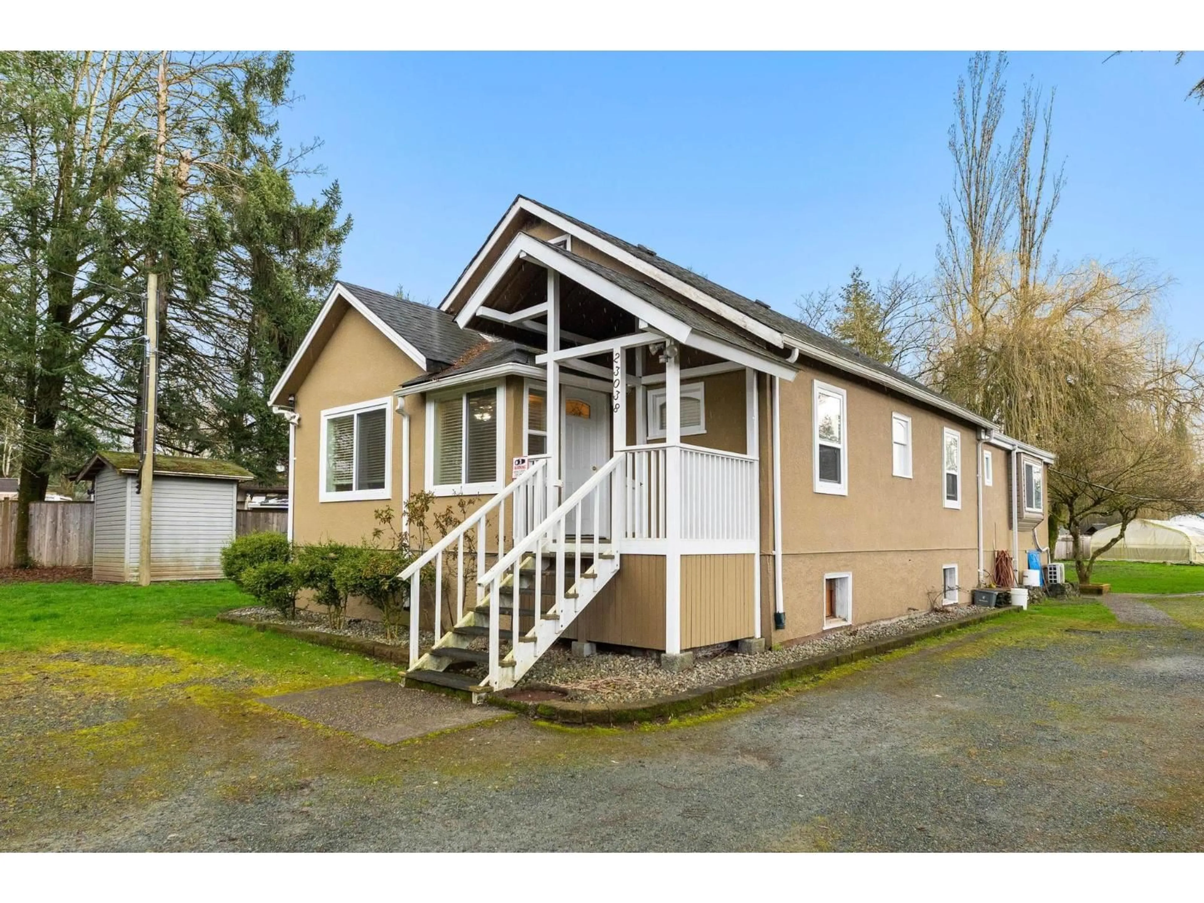 Home with vinyl exterior material, street for 23038 FRASER HIGHWAY, Langley British Columbia V2Z2V1