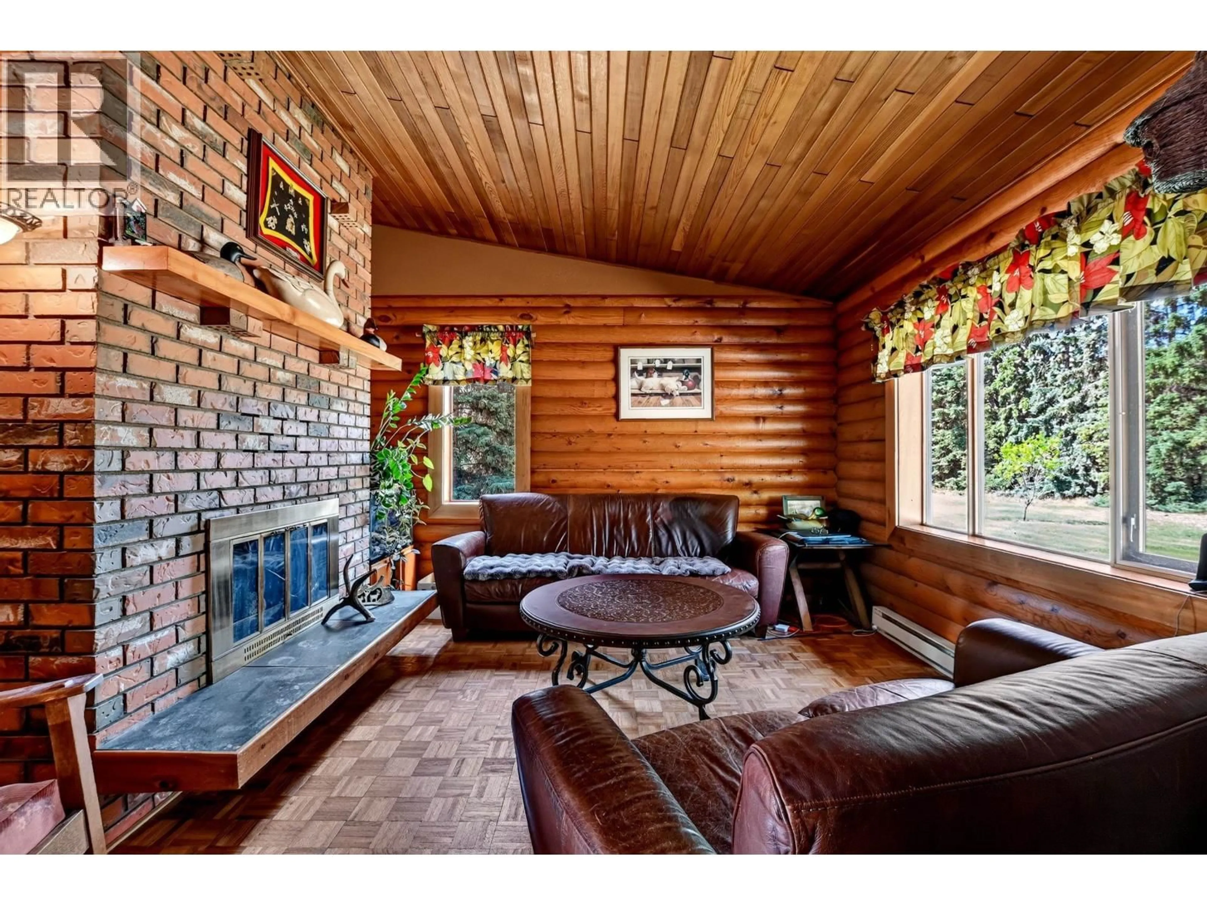 Living room with furniture, wood/laminate floor for 717 FRANCOIS LAKE ROAD, Fraser Lake British Columbia V0J1S0