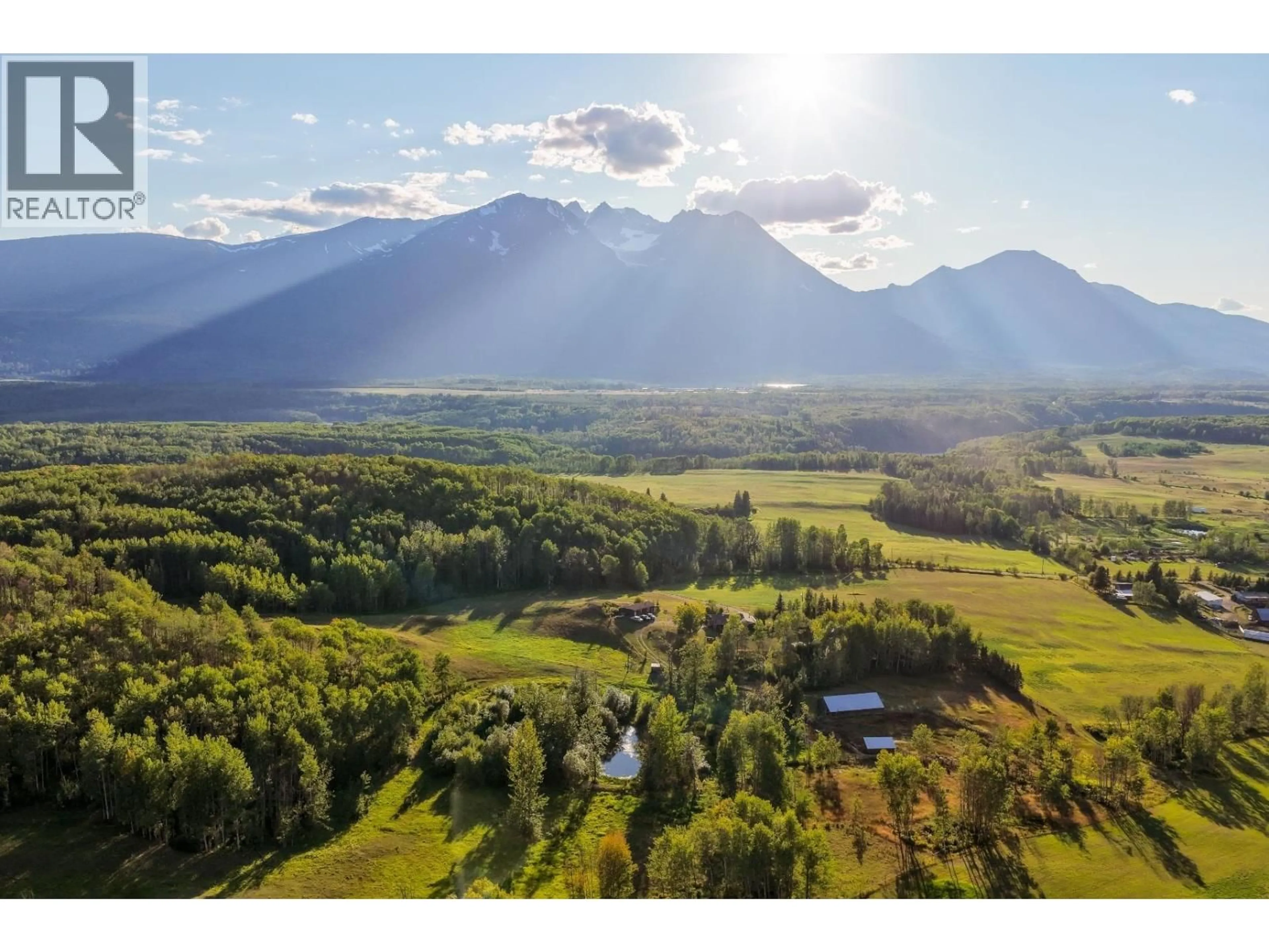 A pic from outside/outdoor area/front of a property/back of a property/a pic from drone, mountain view for 6640 SNAKE ROAD, Smithers British Columbia V0J2N7