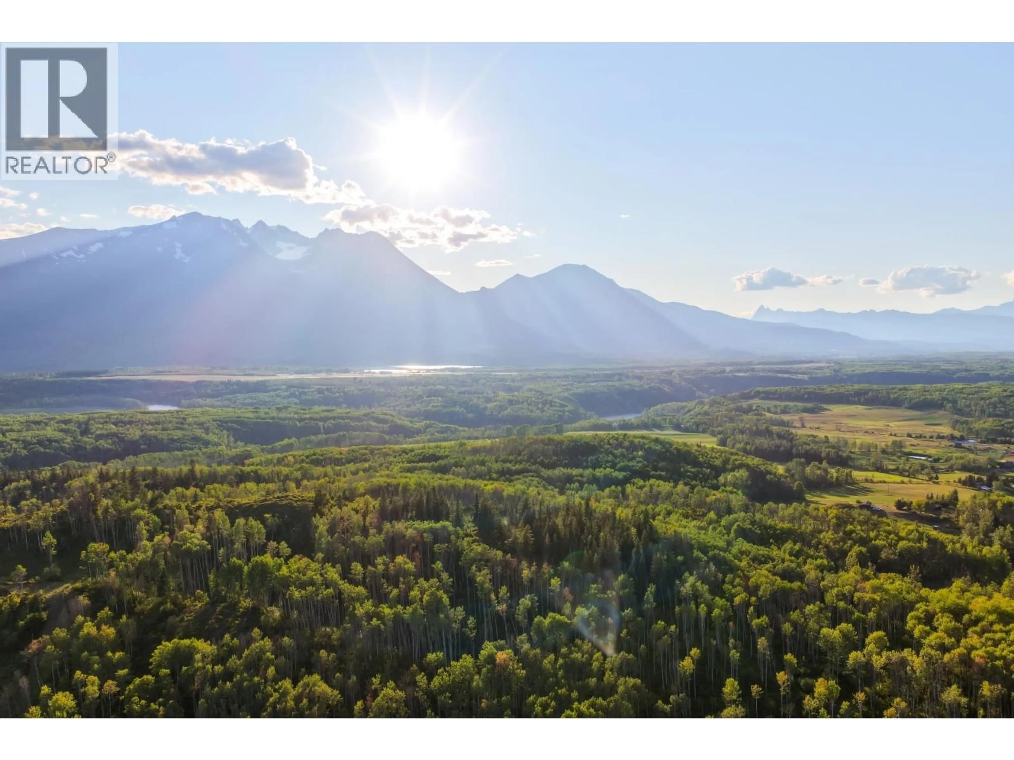 A pic from outside/outdoor area/front of a property/back of a property/a pic from drone, mountain view for 6640 SNAKE ROAD, Smithers British Columbia V0J2N7