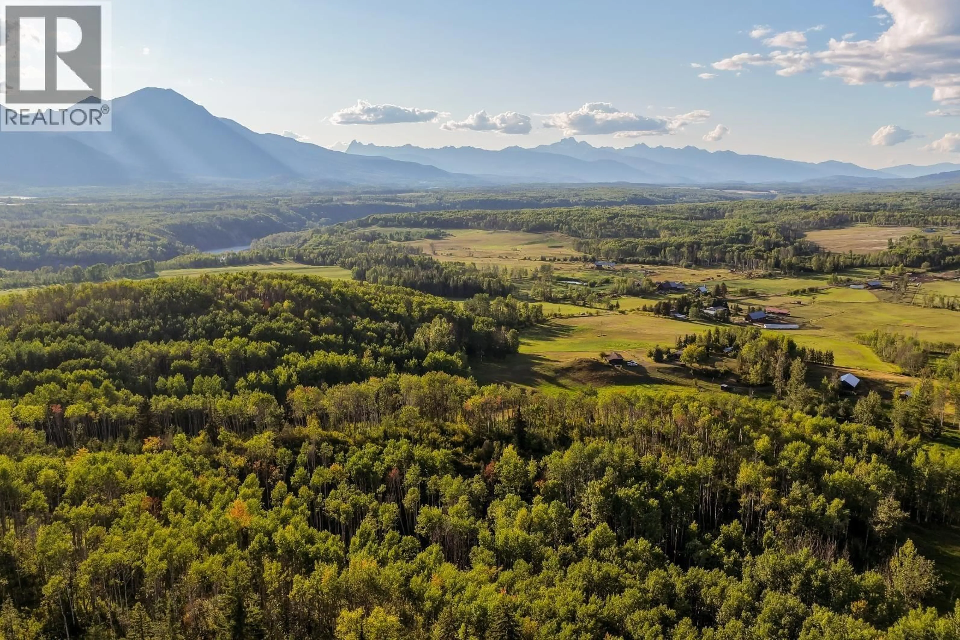 A pic from outside/outdoor area/front of a property/back of a property/a pic from drone, mountain view for 6640 SNAKE ROAD, Smithers British Columbia V0J2N7