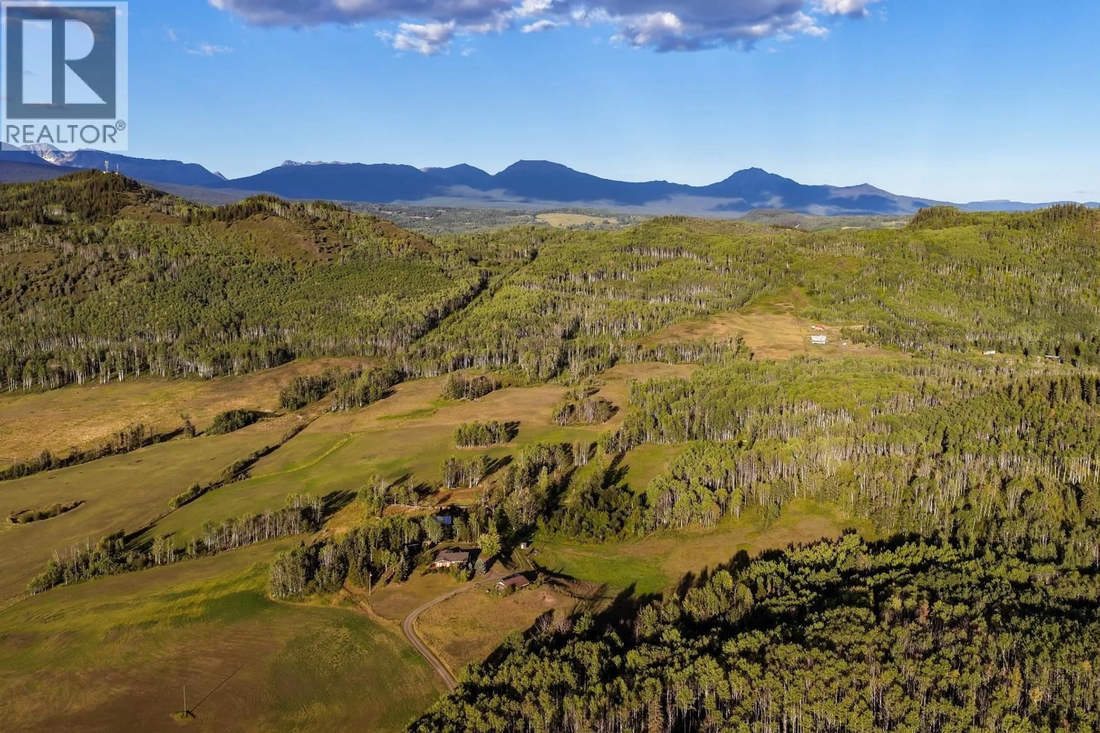 A pic from outside/outdoor area/front of a property/back of a property/a pic from drone, mountain view for 6640 SNAKE ROAD, Smithers British Columbia V0J2N7