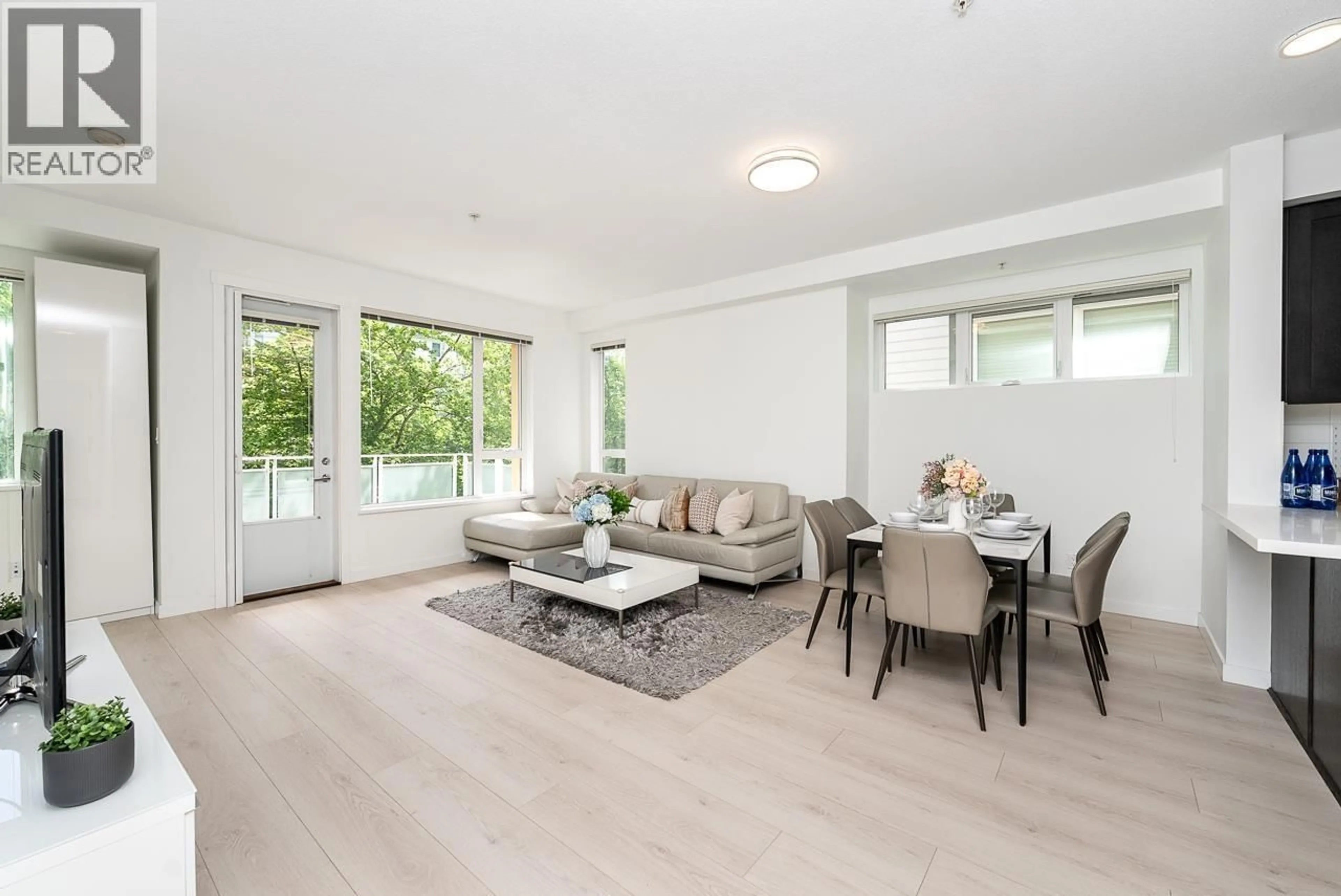Living room with furniture, wood/laminate floor for 3187 KENT AVENUE NORTH, Vancouver British Columbia V5S4Y1