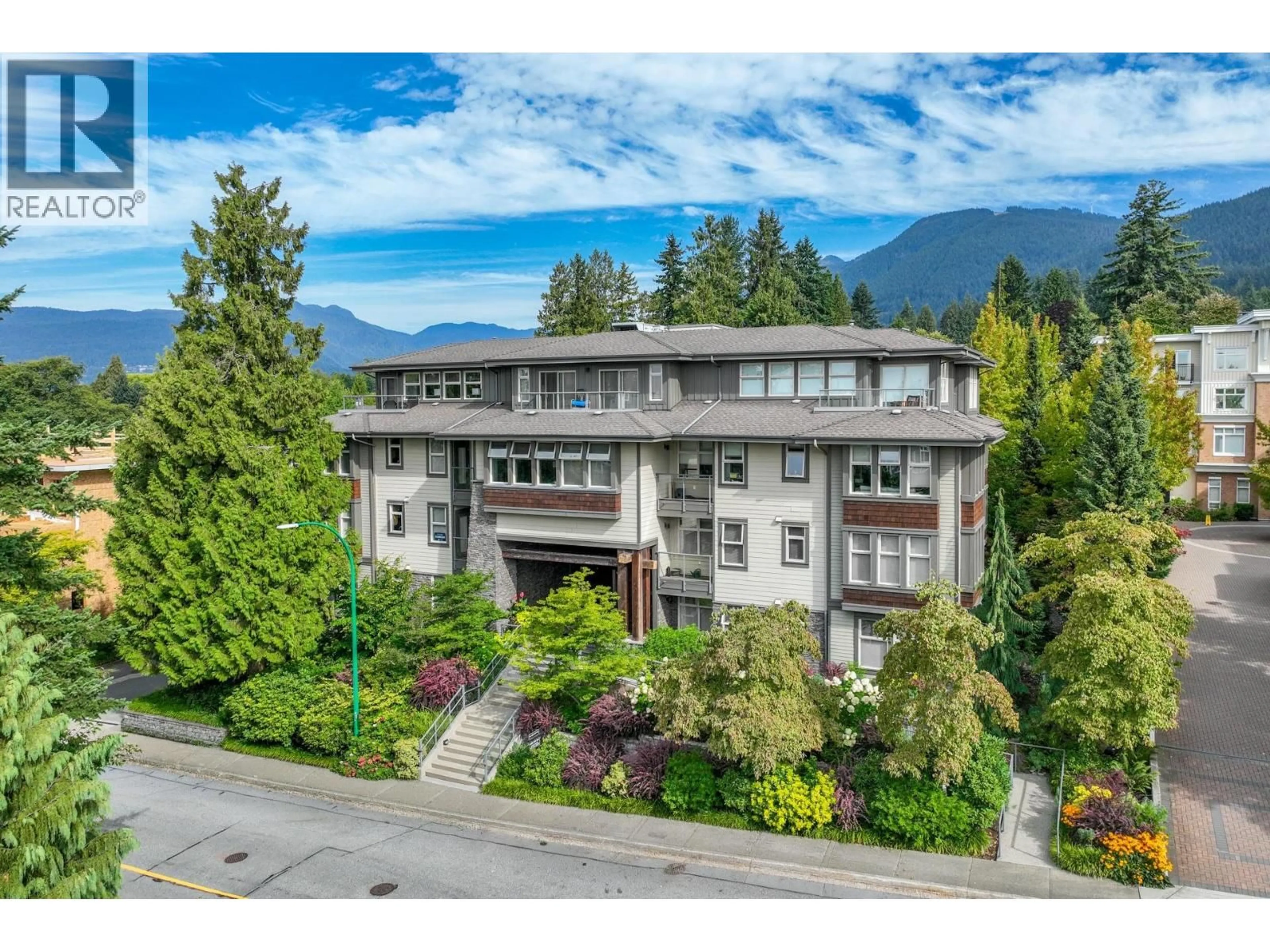 A pic from outside/outdoor area/front of a property/back of a property/a pic from drone, mountain view for 206 - 188 29TH STREET, North Vancouver British Columbia V7N0A2