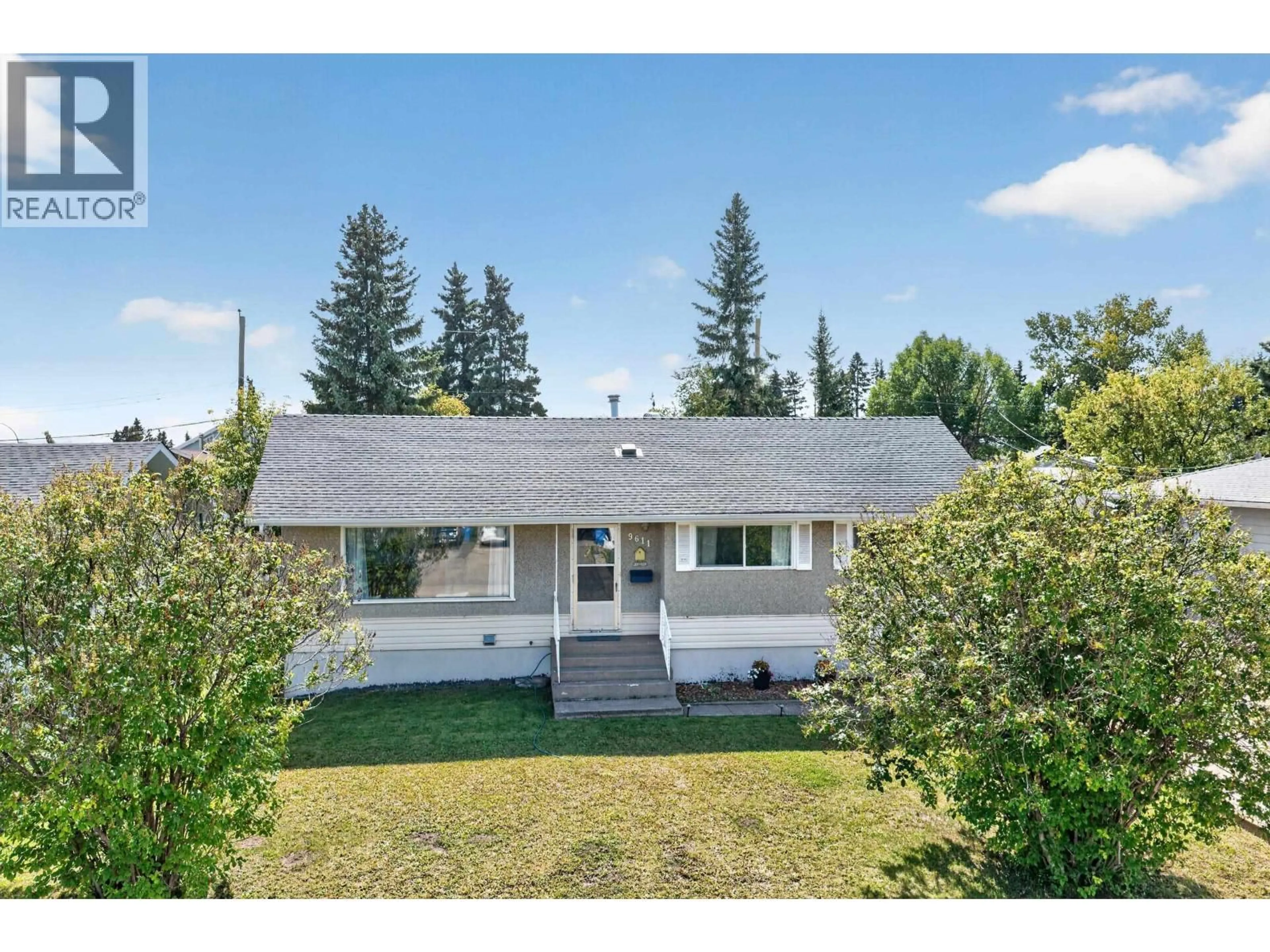 A pic from outside/outdoor area/front of a property/back of a property/a pic from drone, mountain view for 9611 108 AVENUE, Fort St. John British Columbia V1J2P9