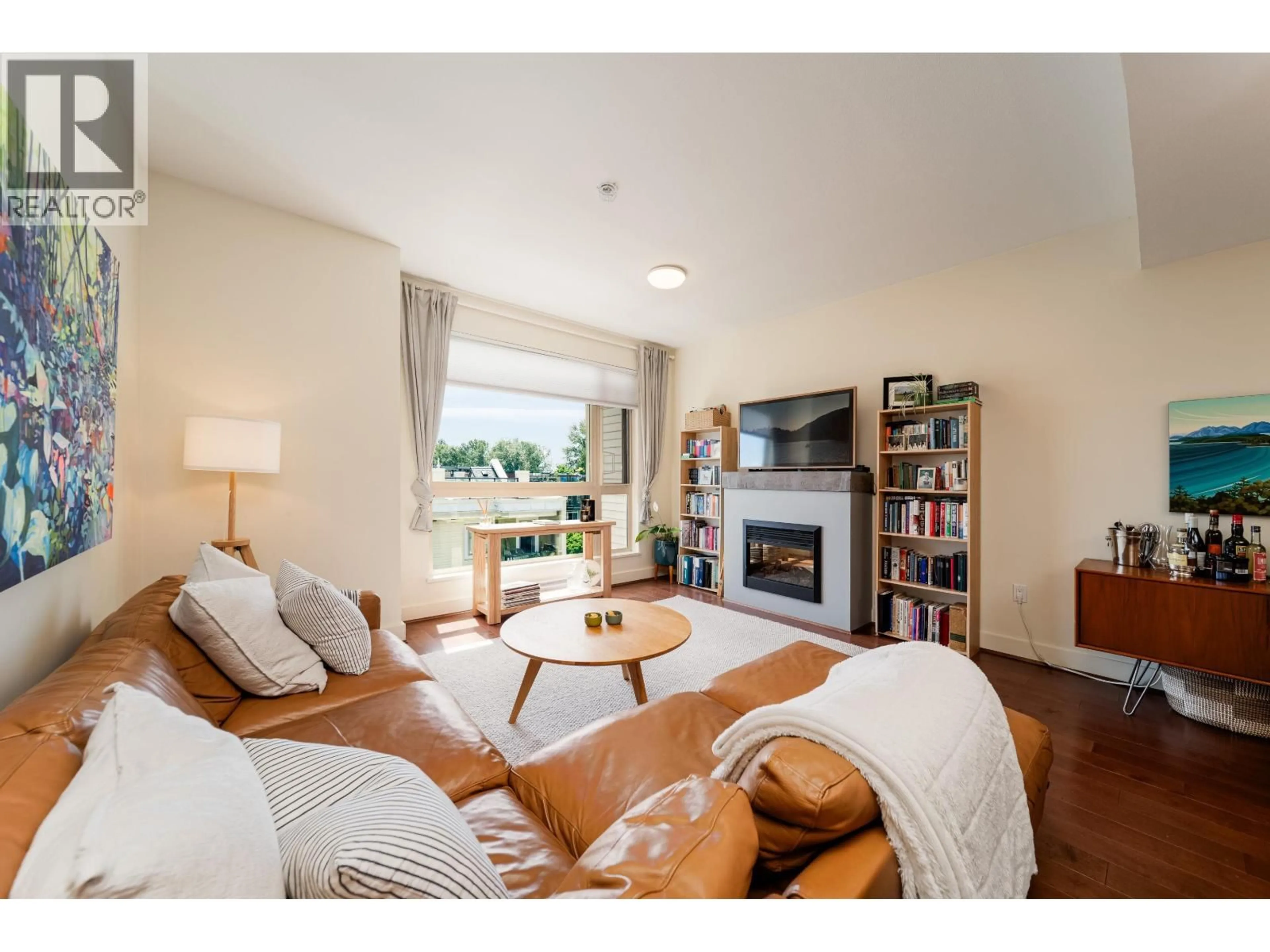 Living room with furniture, wood/laminate floor for 64 - 728 14TH STREET, North Vancouver British Columbia V7M0A8