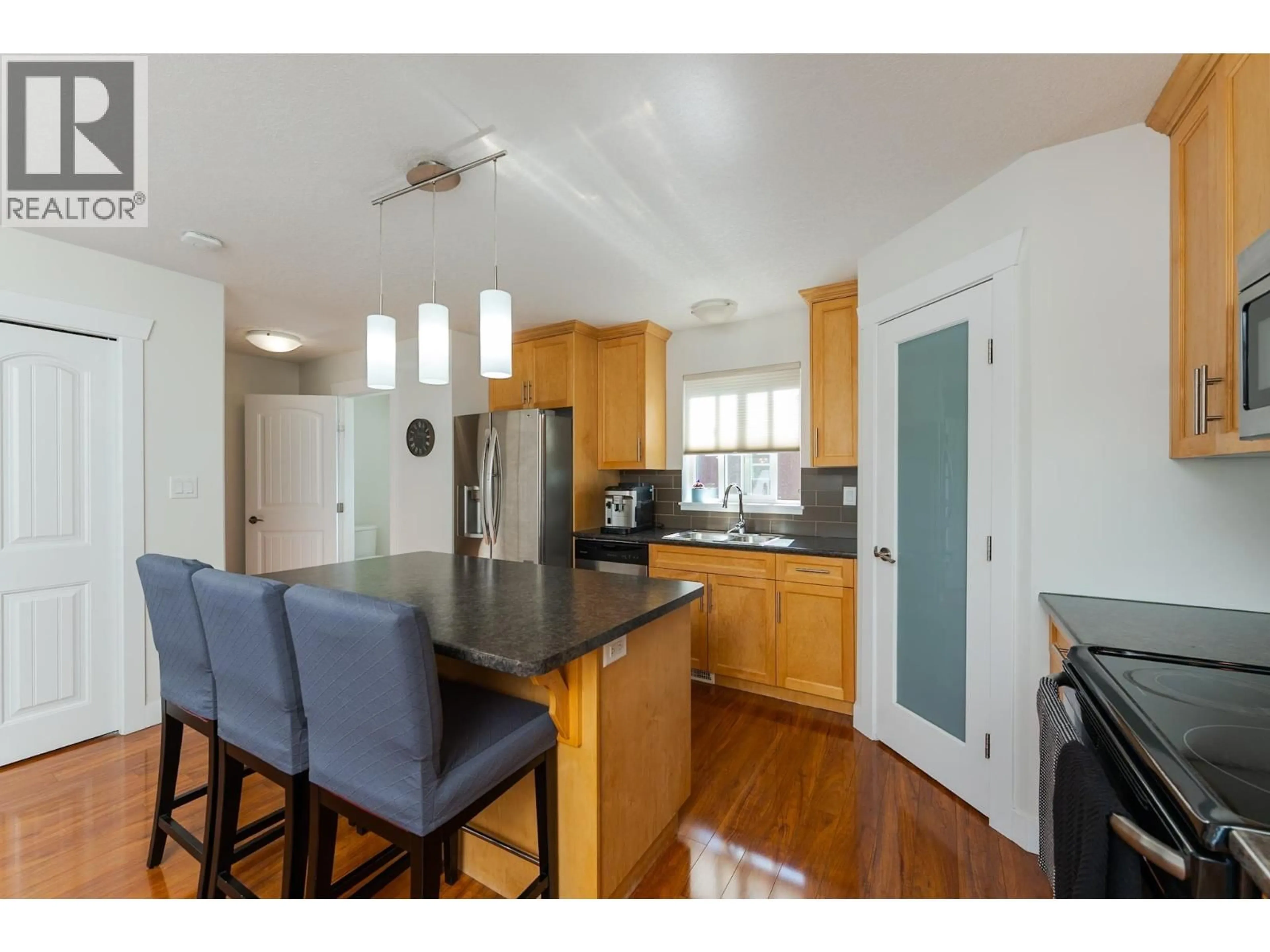 Open concept kitchen, wood/laminate floor for 106 - 1699 7TH AVENUE, Prince George British Columbia V2L0C1