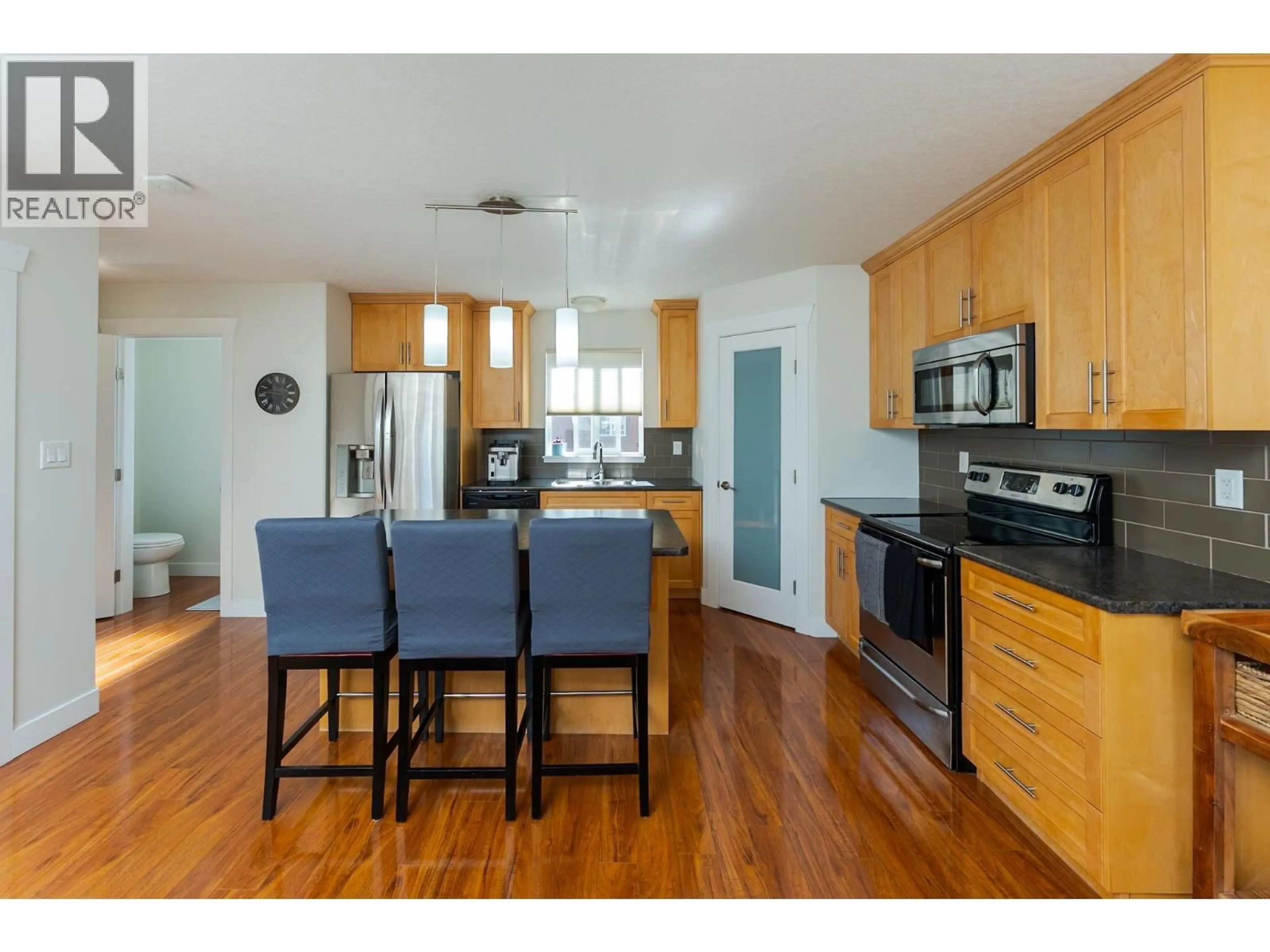 Open concept kitchen, wood/laminate floor for 106 - 1699 7TH AVENUE, Prince George British Columbia V2L0C1