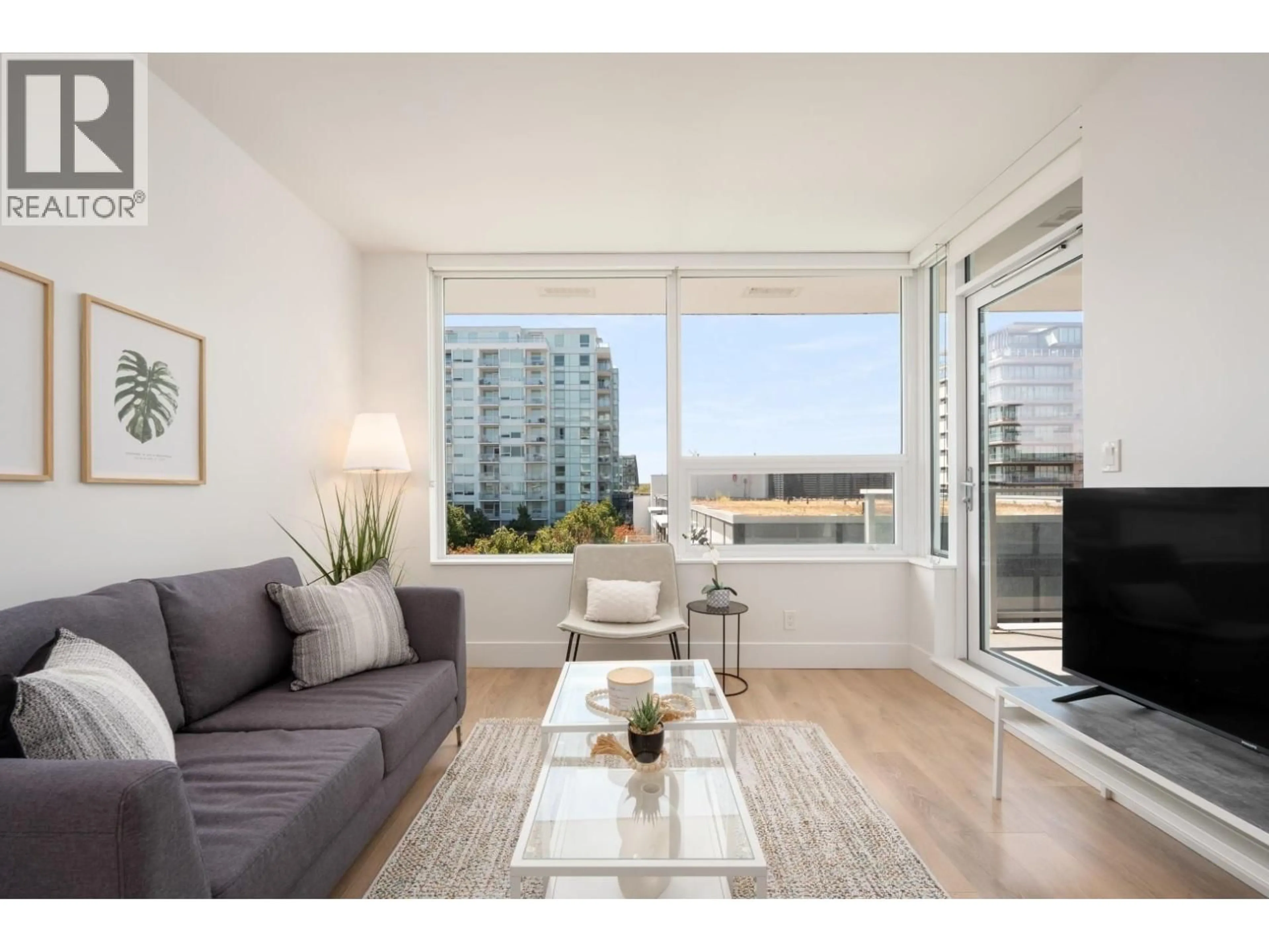 Living room with furniture, wood/laminate floor for 706 - 6900 PEARSON WAY, Richmond British Columbia V7C0C9