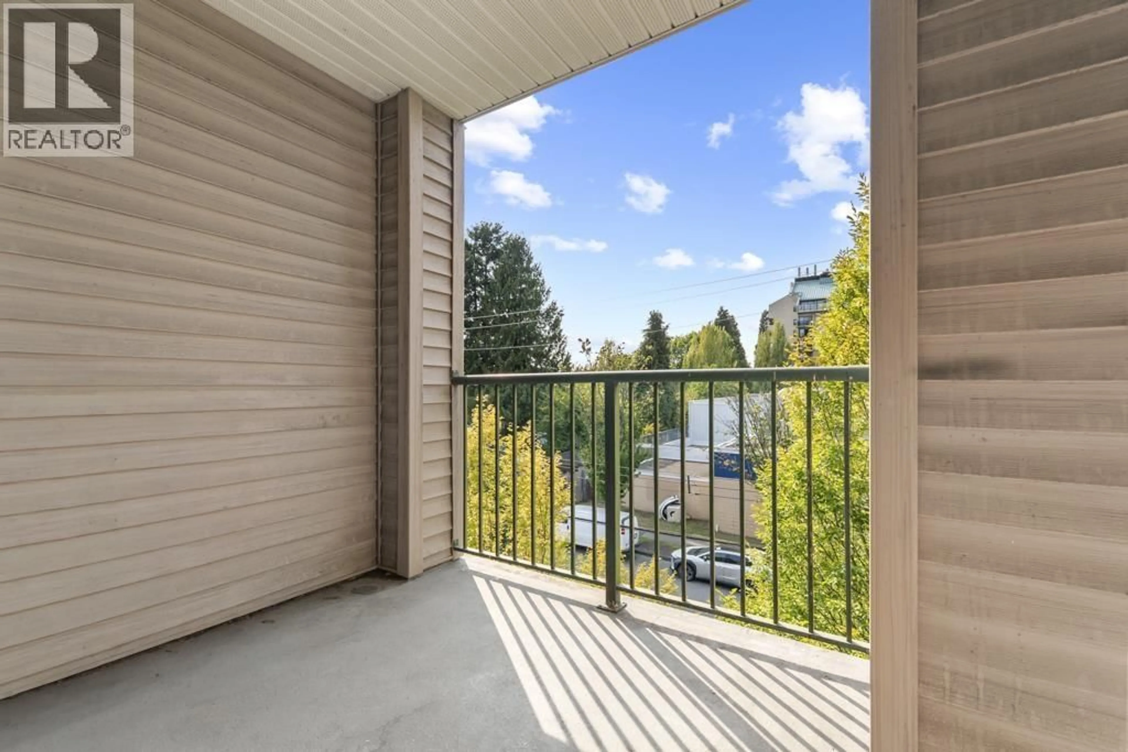 Balcony in the apartment, city buildings view from balcony for 203 - 5625 SENLAC STREET, Vancouver British Columbia V5R6G8