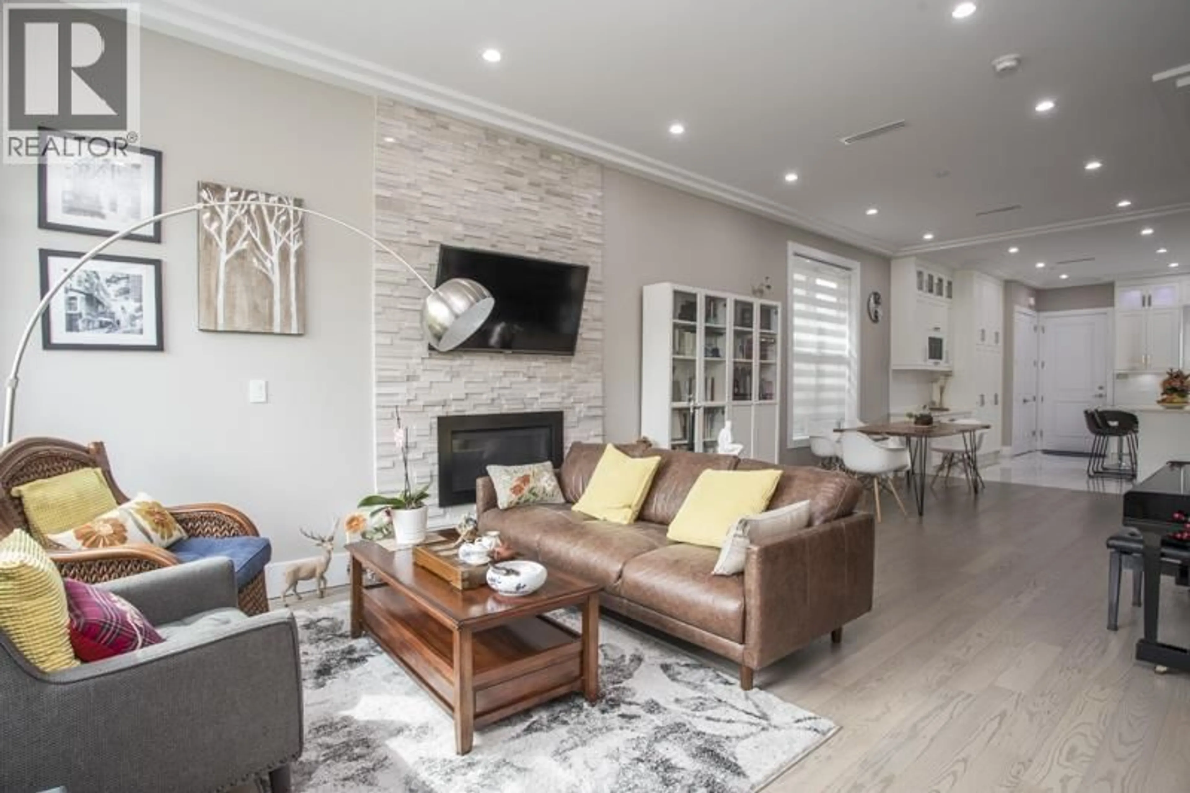 Living room with furniture, wood/laminate floor for 8559 MONTCALM STREET, Vancouver British Columbia V6P4P6