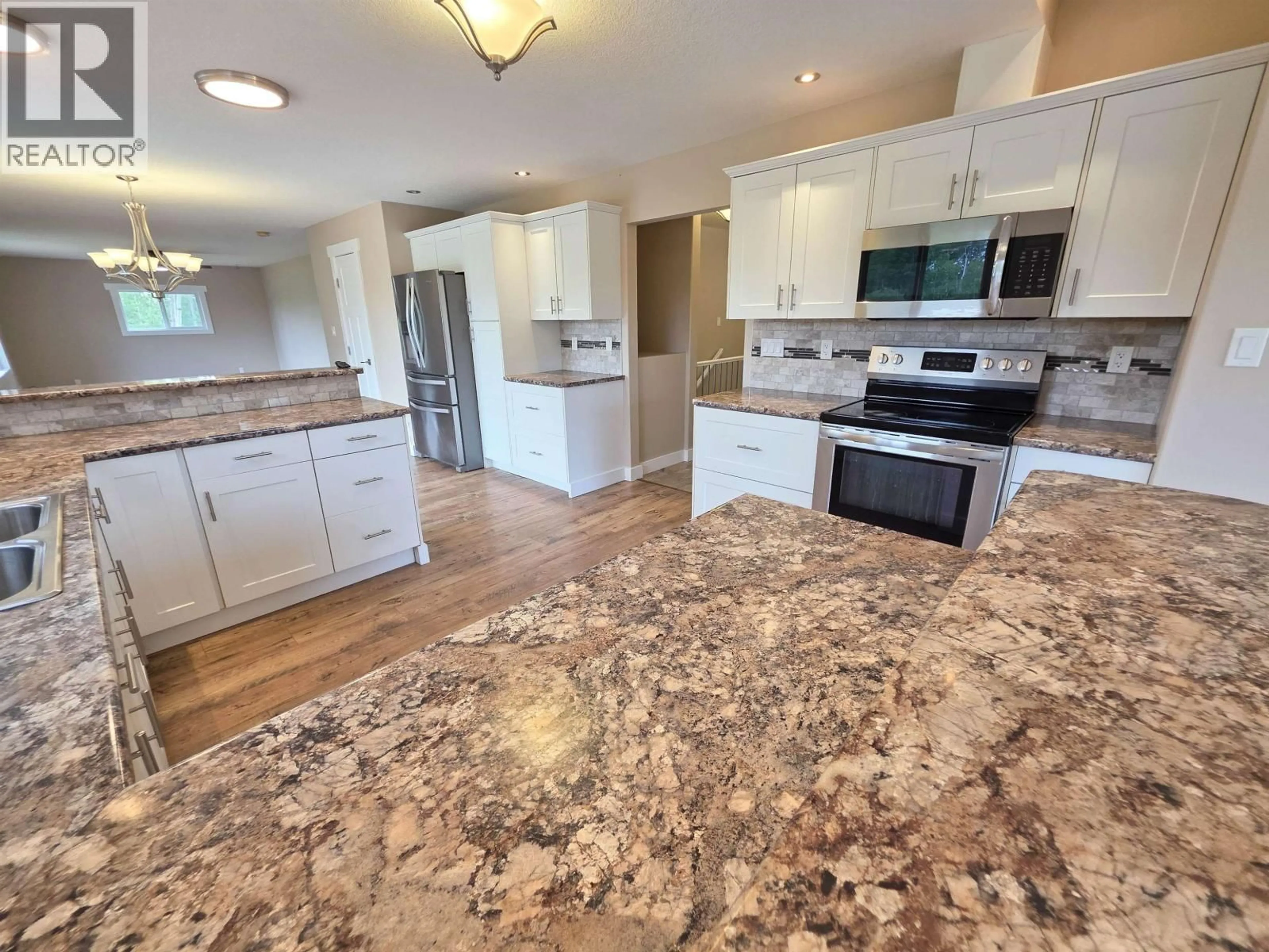 Open concept kitchen, ceramic/tile floor for 7446 255 ROAD, Fort St. John British Columbia V0C1C4