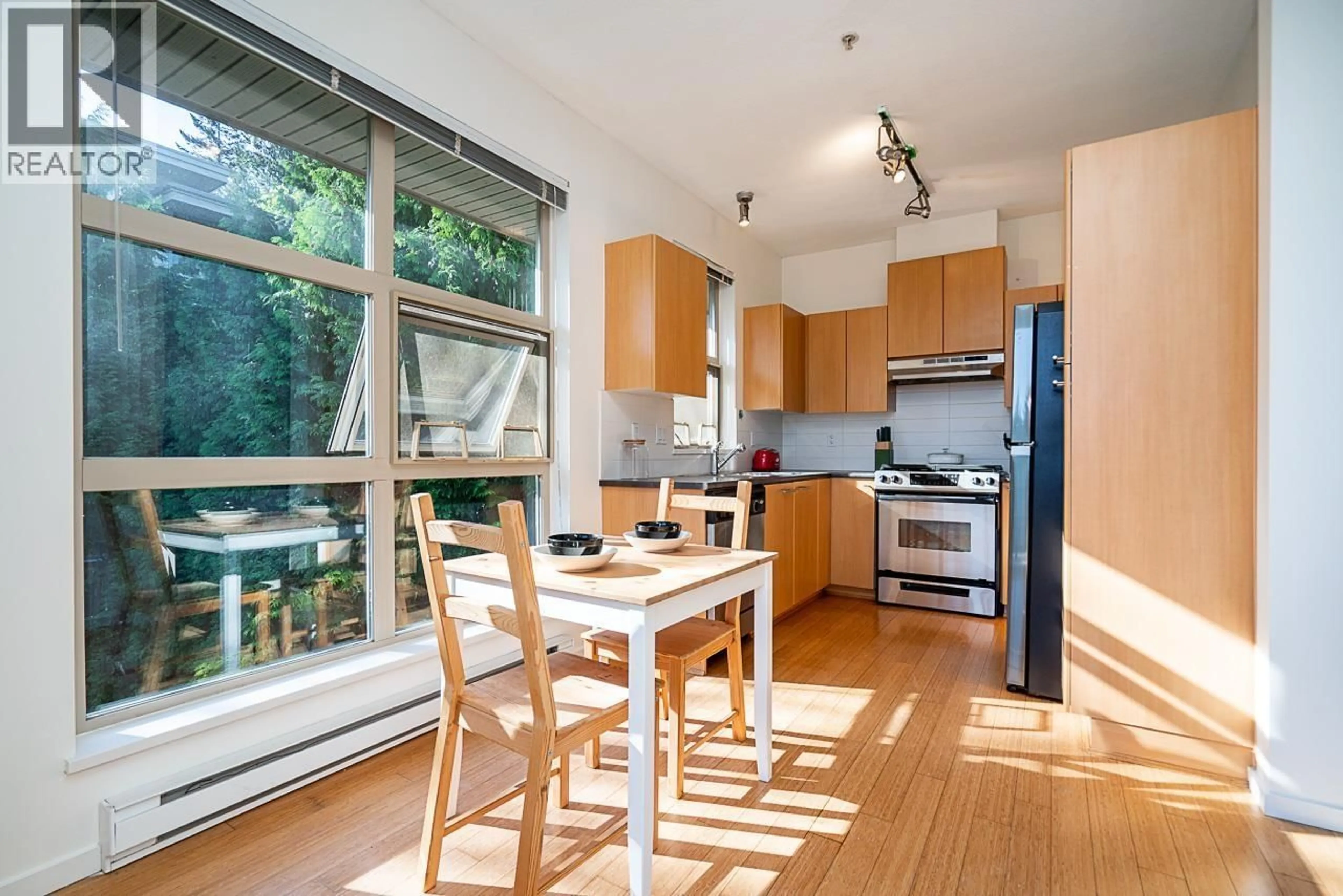 Open concept kitchen, wood/laminate floor for 516 - 9319 UNIVERSITY CRESCENT, Burnaby British Columbia V5A4Y5