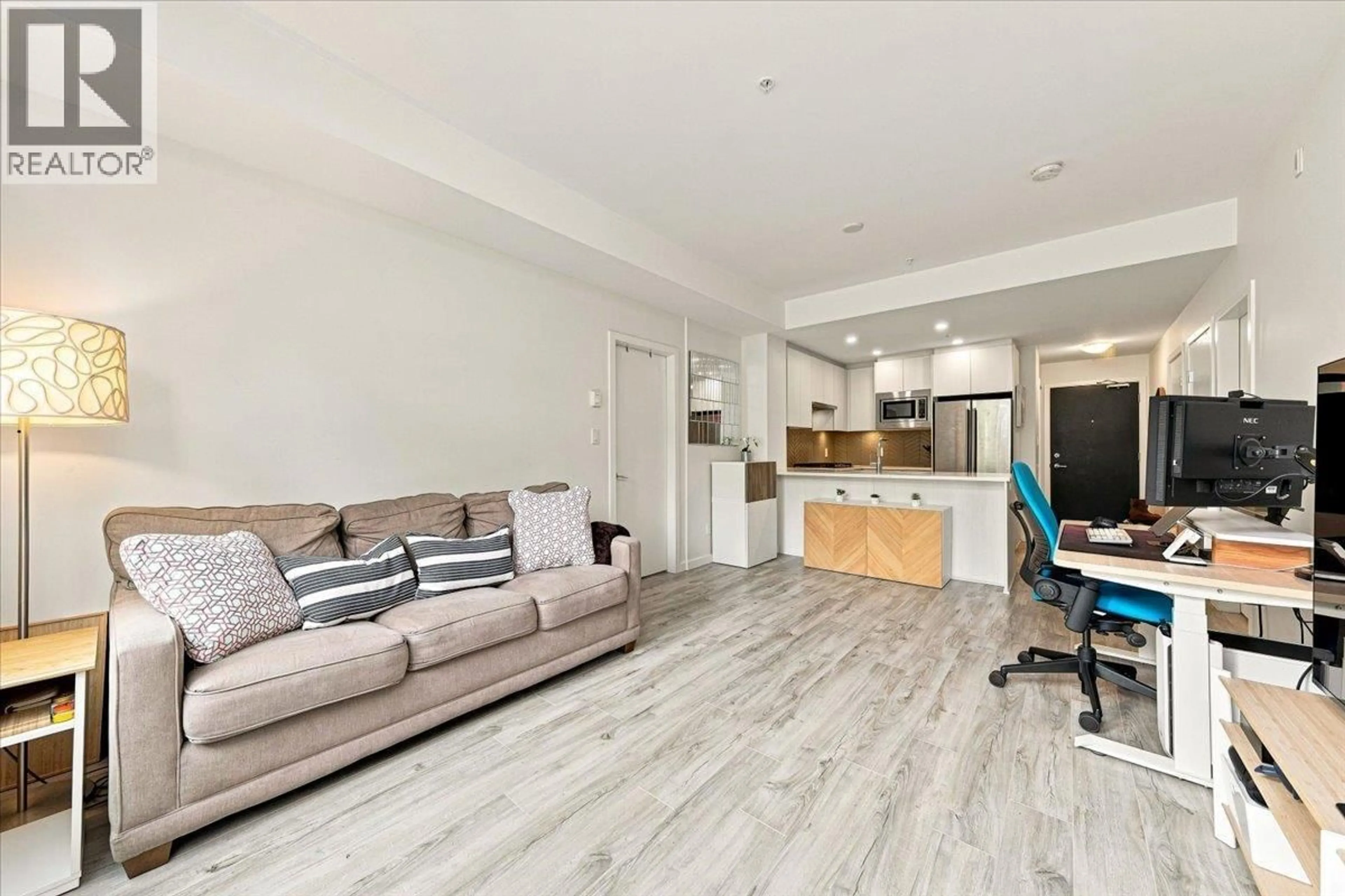 Living room with furniture, wood/laminate floor for 205 - 717 BRESLAY STREET, Coquitlam British Columbia V3J0J3