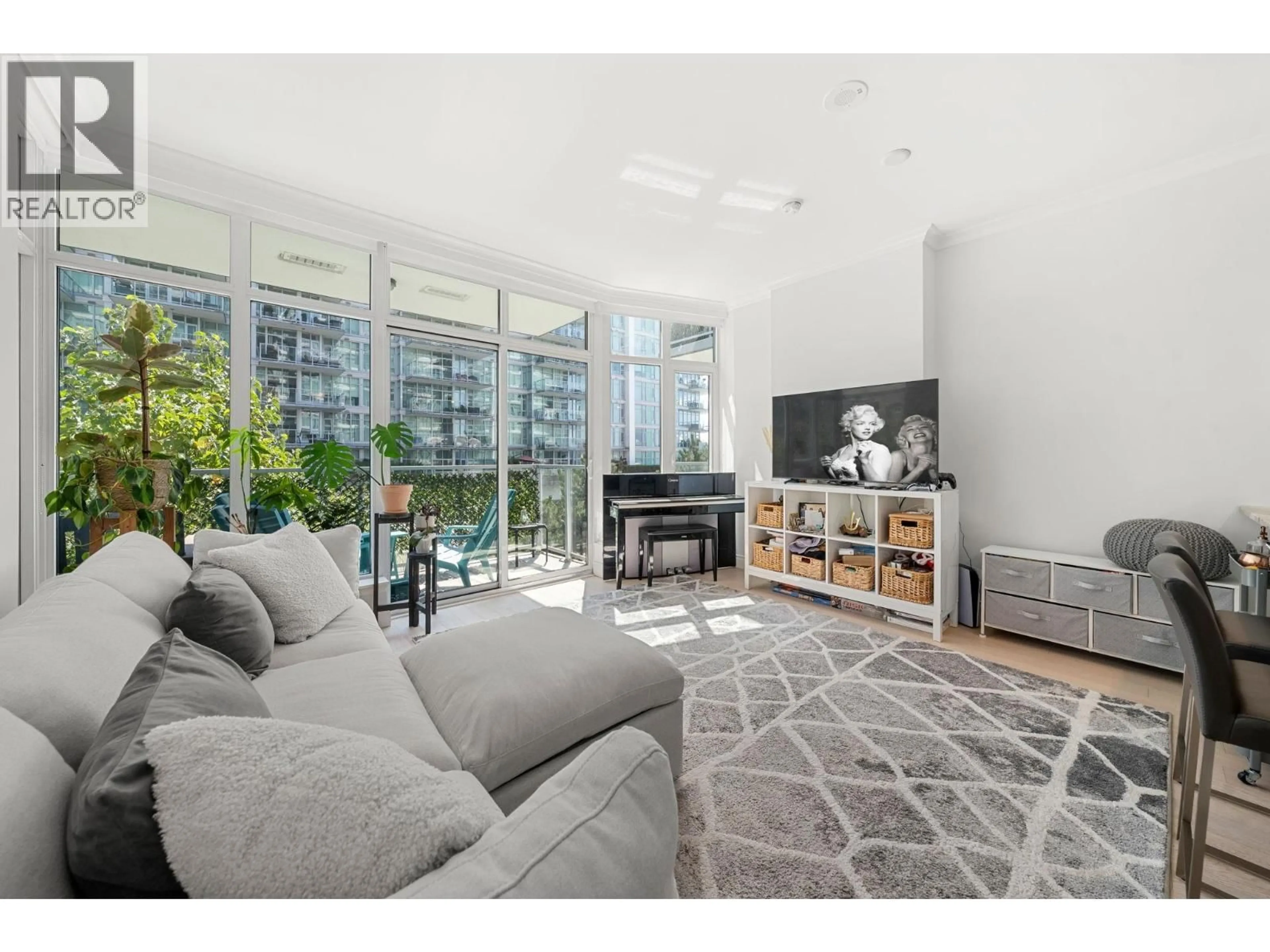 Living room with furniture, unknown for 201 - 175 VICTORY SHIP WAY, North Vancouver British Columbia V7L0G1