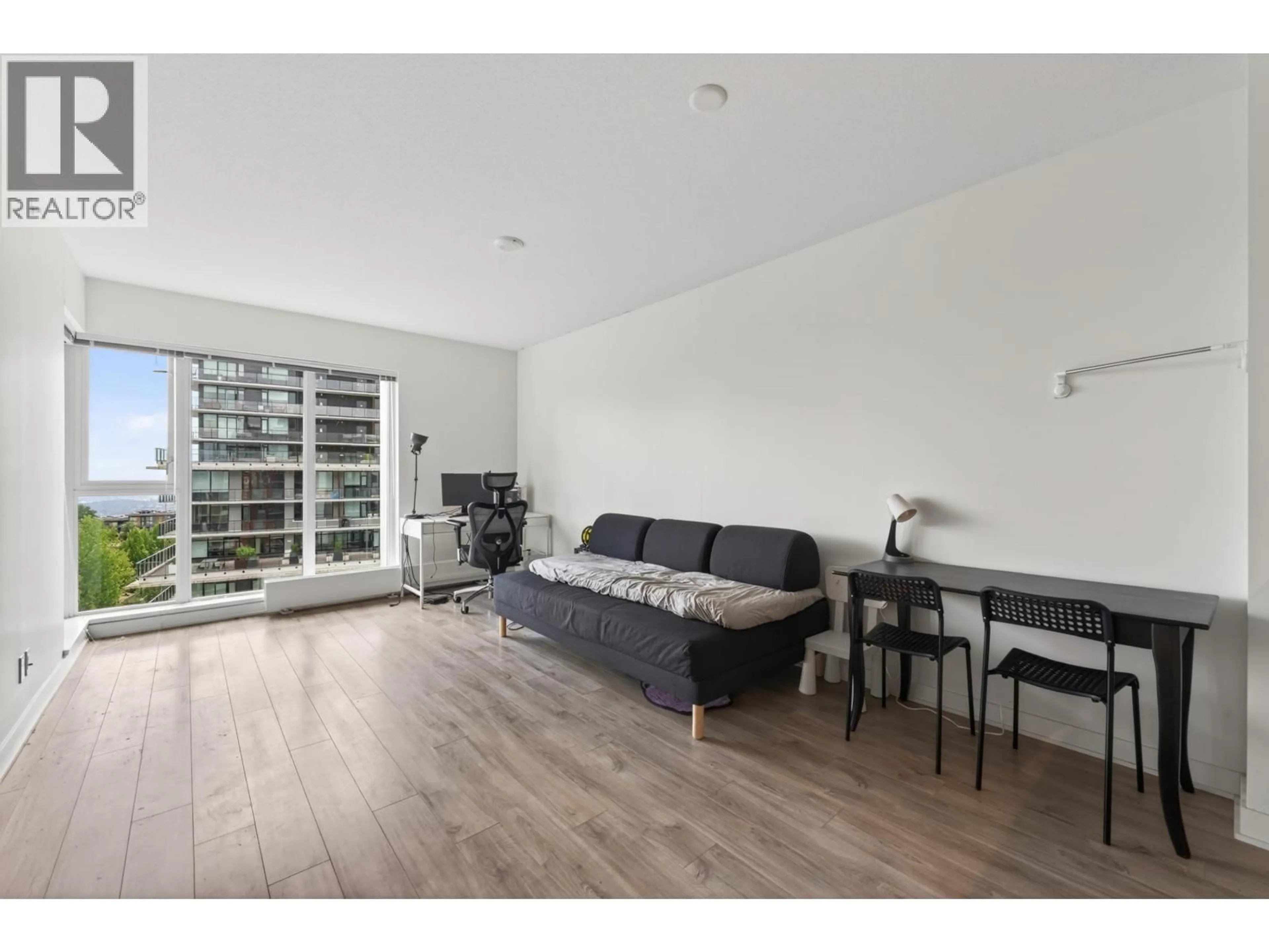 Living room with furniture, wood/laminate floor for 1103 - 8940 UNIVERSITY CRESCENT, Burnaby British Columbia V5A0E7