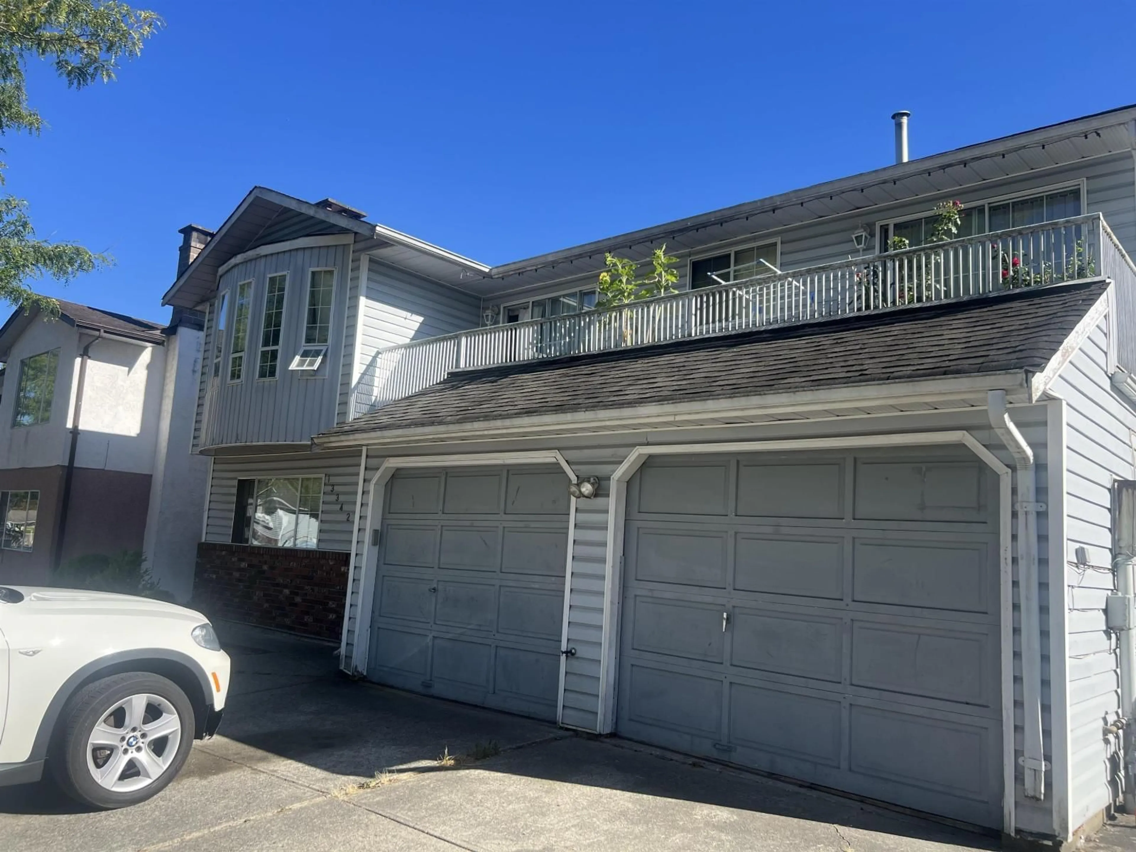 Home with vinyl exterior material, street for 13342 79 AVENUE, Surrey British Columbia V8W8H4