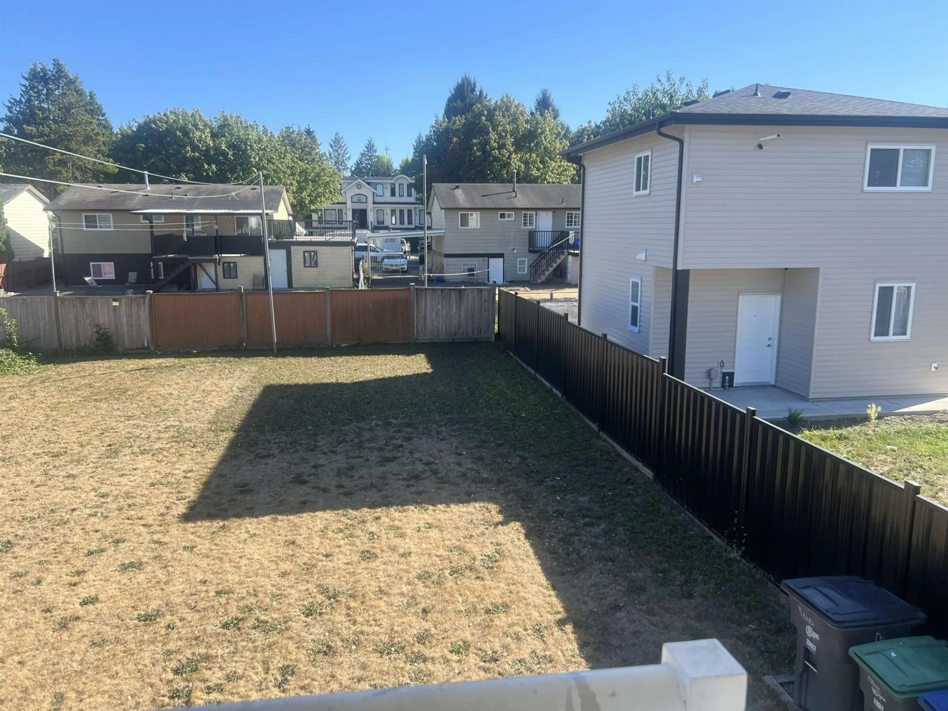A pic from outside/outdoor area/front of a property/back of a property/a pic from drone, street for 13342 79 AVENUE, Surrey British Columbia V8W8H4