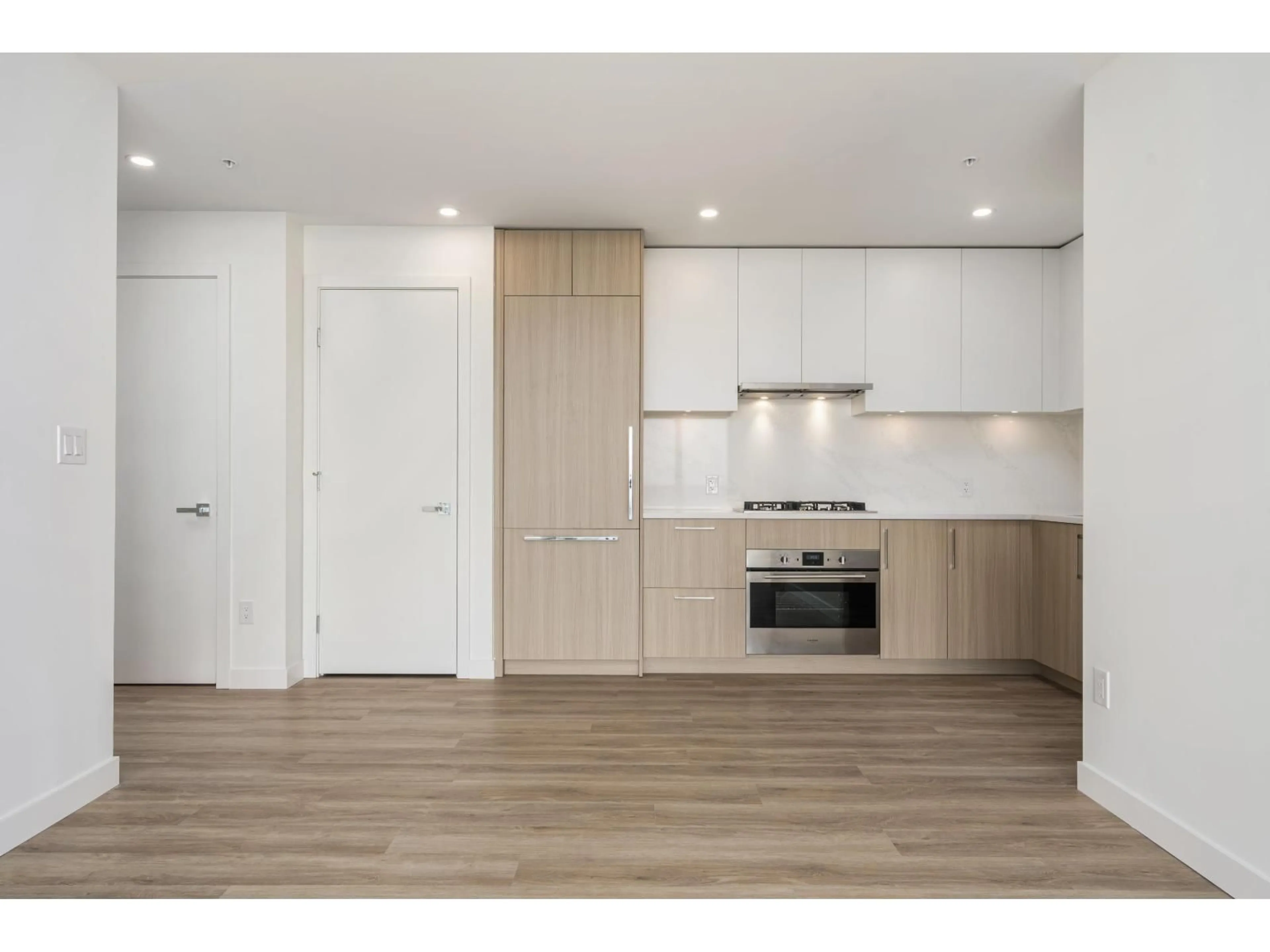 Open concept kitchen, wood/laminate floor for 2801 - 9675 KING GEORGE BOULEVARD, Surrey British Columbia V3T0T7