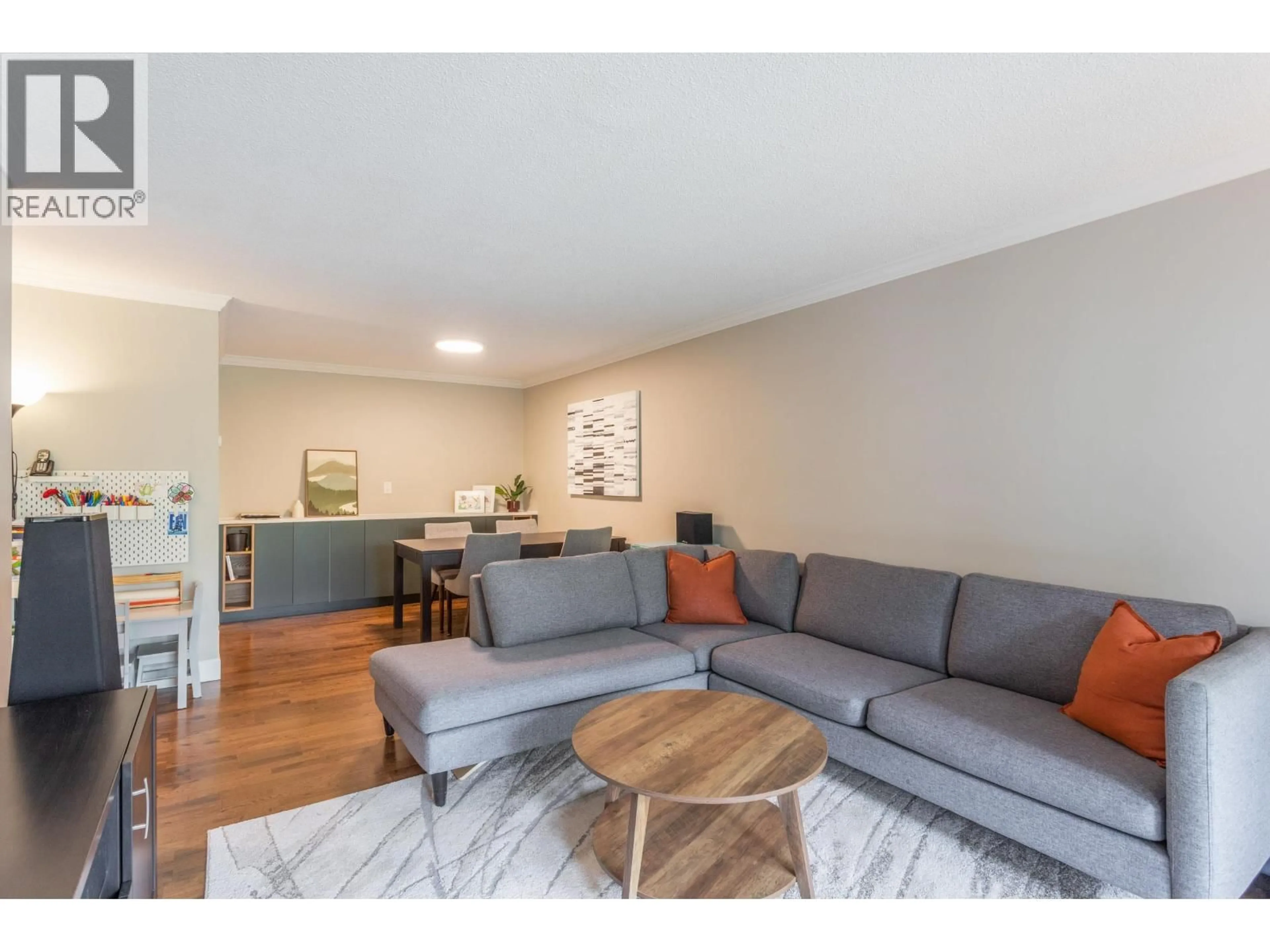 Living room with furniture, wood/laminate floor for 209 - 8860 NO. 1 ROAD, Richmond British Columbia V7C4C2