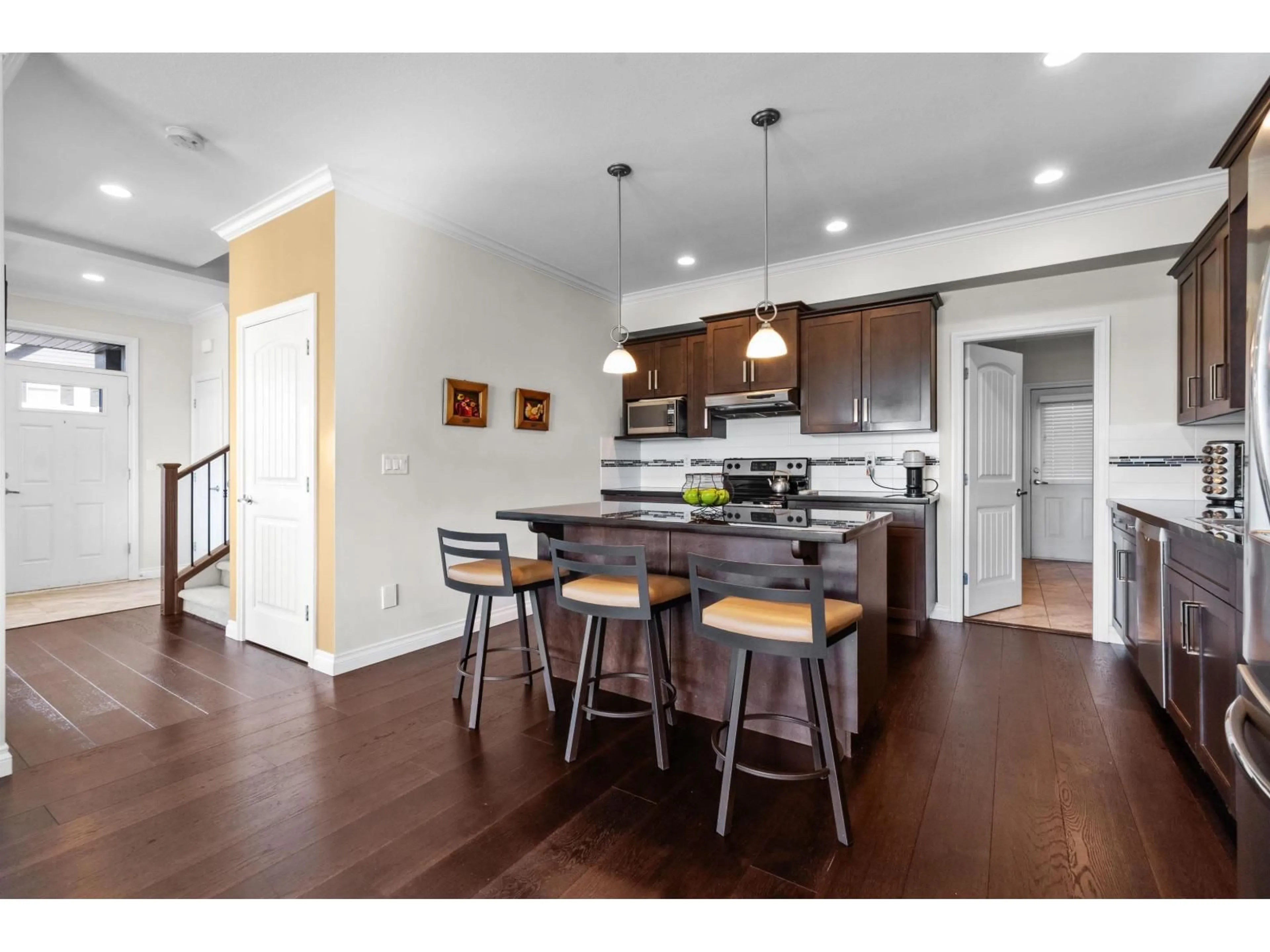 Open concept kitchen, wood/laminate floor for 6898 177 STREET, Surrey British Columbia V3S2K1