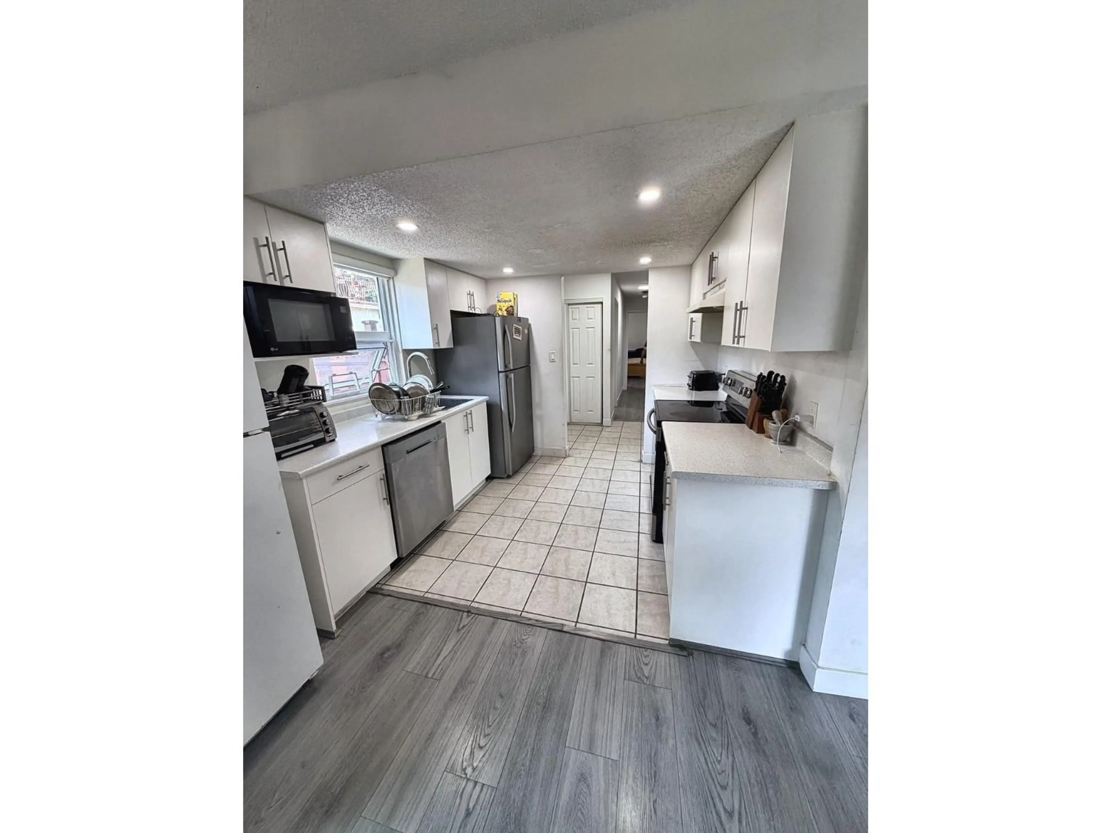 Open concept kitchen, unknown for 101 - 7131 133A STREET, Surrey British Columbia V3W8A1
