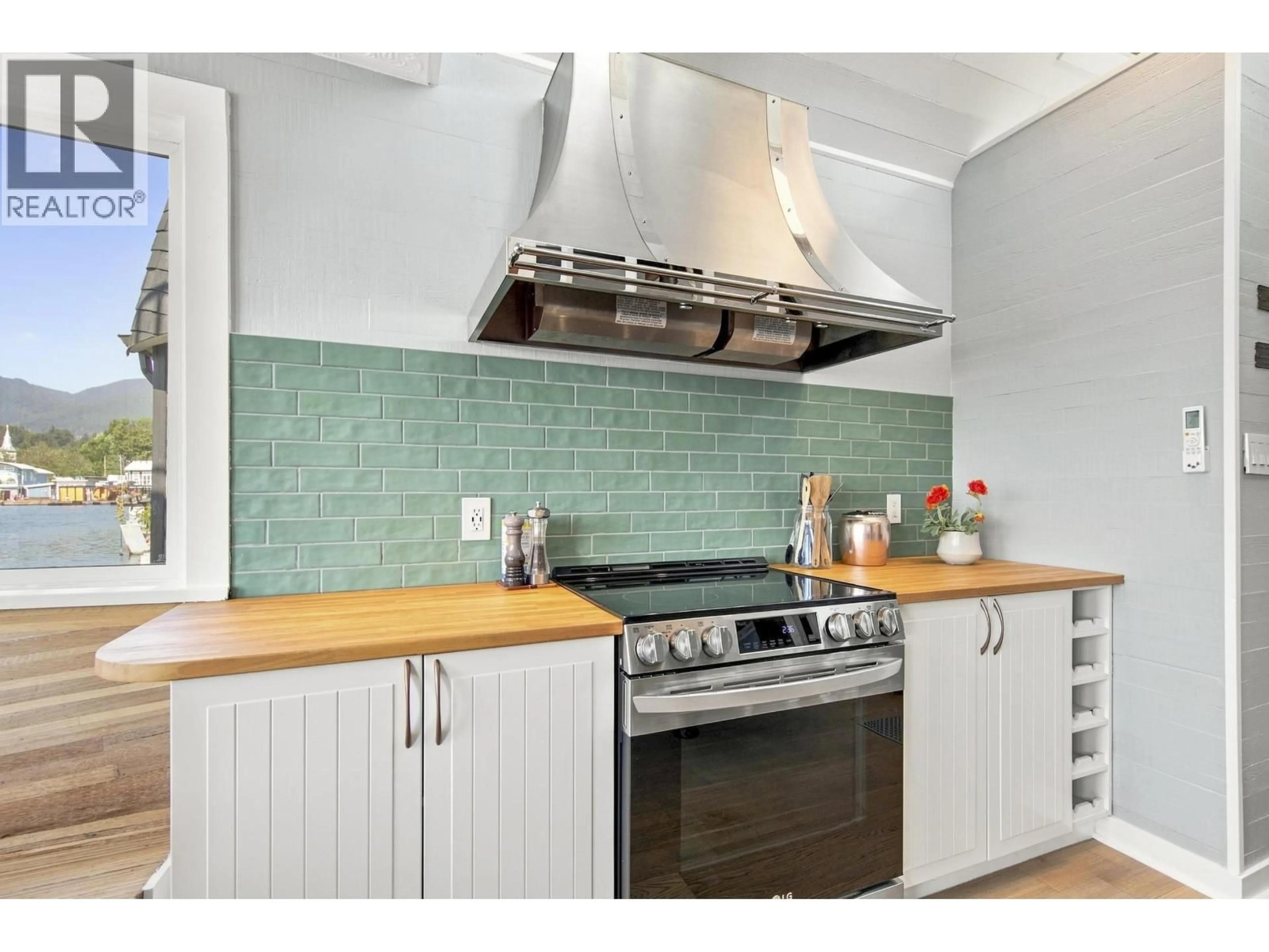 Contemporary kitchen, ceramic/tile floor for A23 - 415 ESPLANADE AVENUE, North Vancouver British Columbia V7M1A6