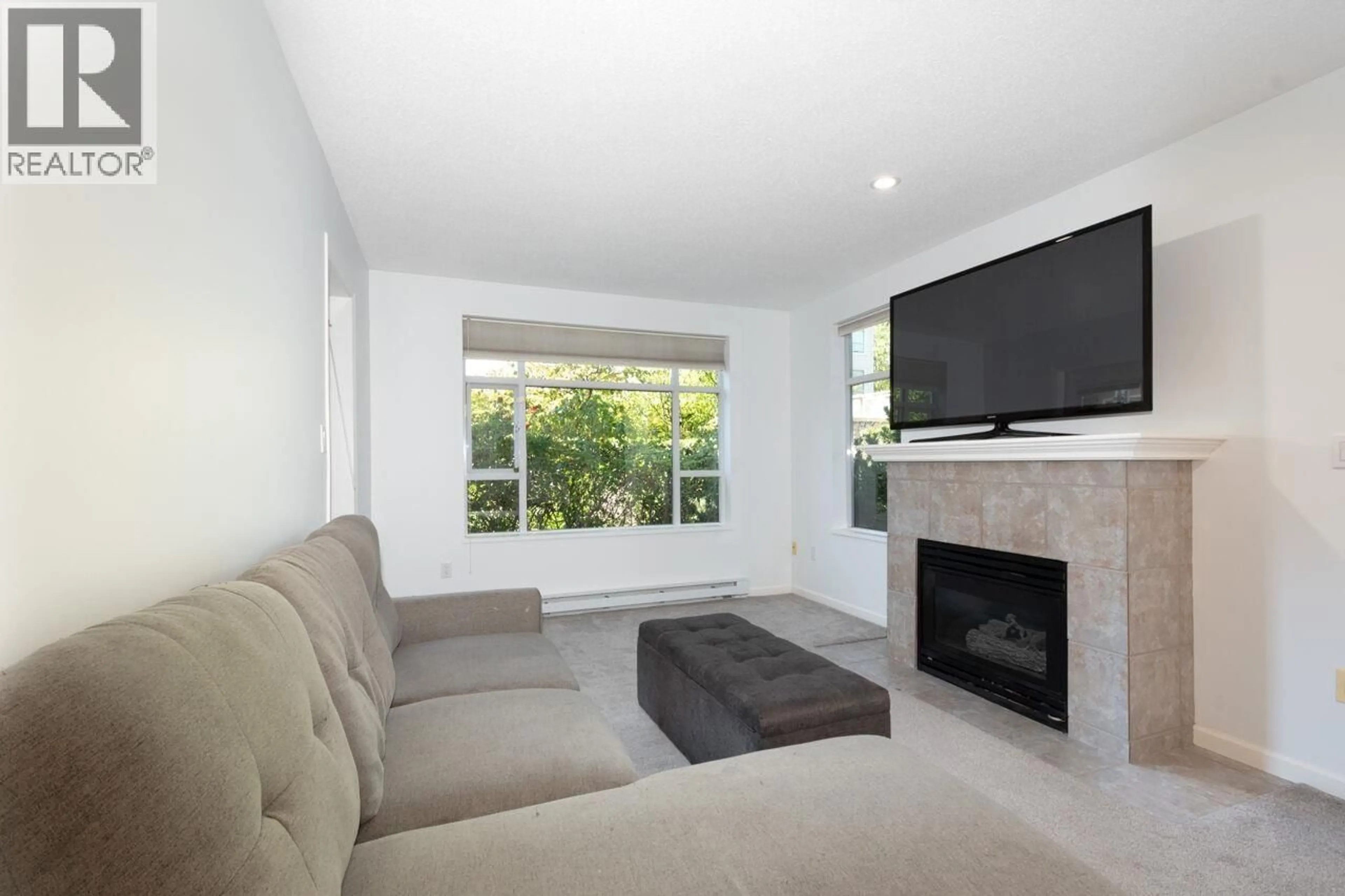 Living room with furniture, unknown for 104 - 3625 WINDCREST DRIVE, North Vancouver British Columbia V7G2S6