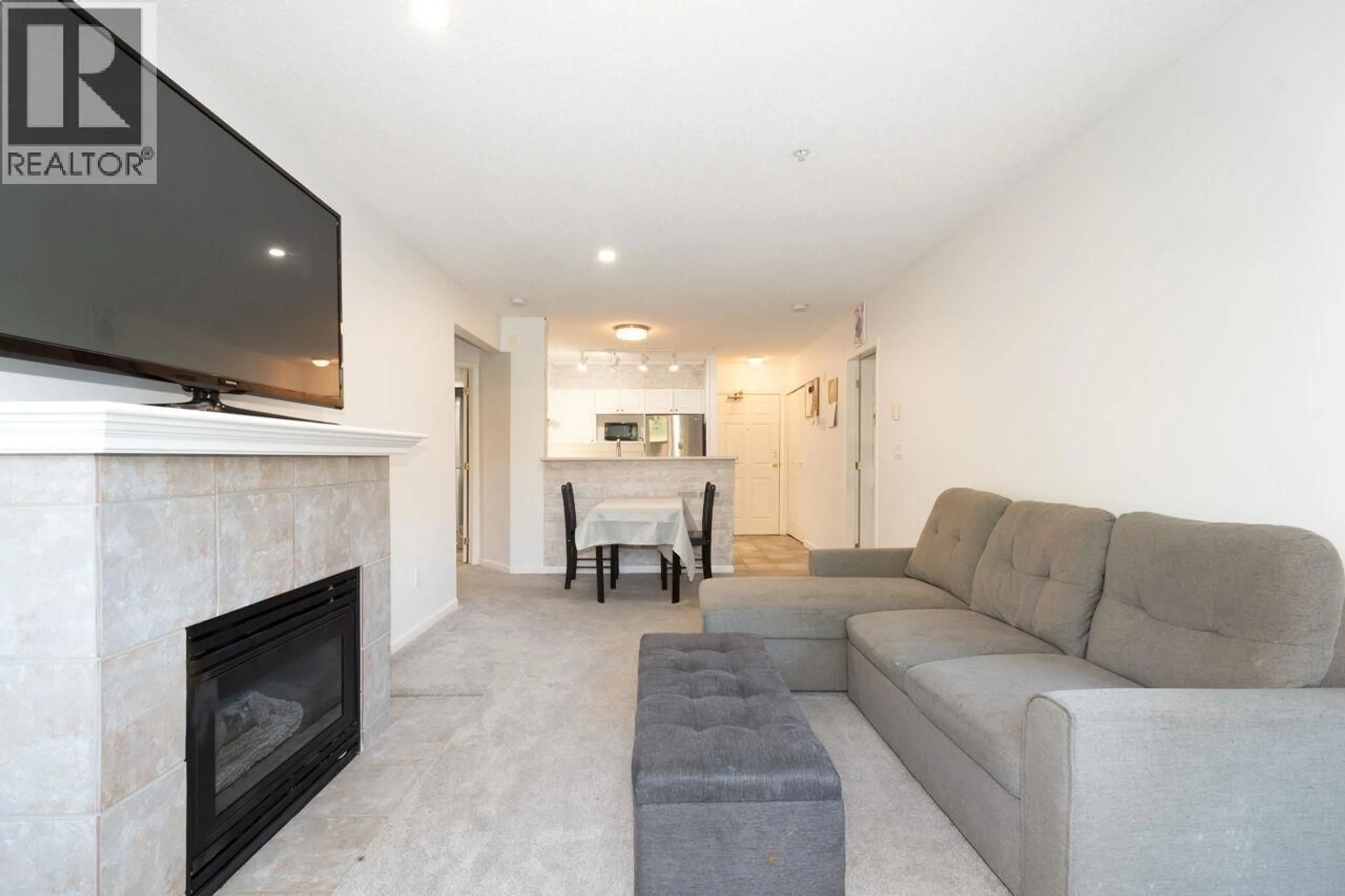 Living room with furniture, unknown for 104 - 3625 WINDCREST DRIVE, North Vancouver British Columbia V7G2S6