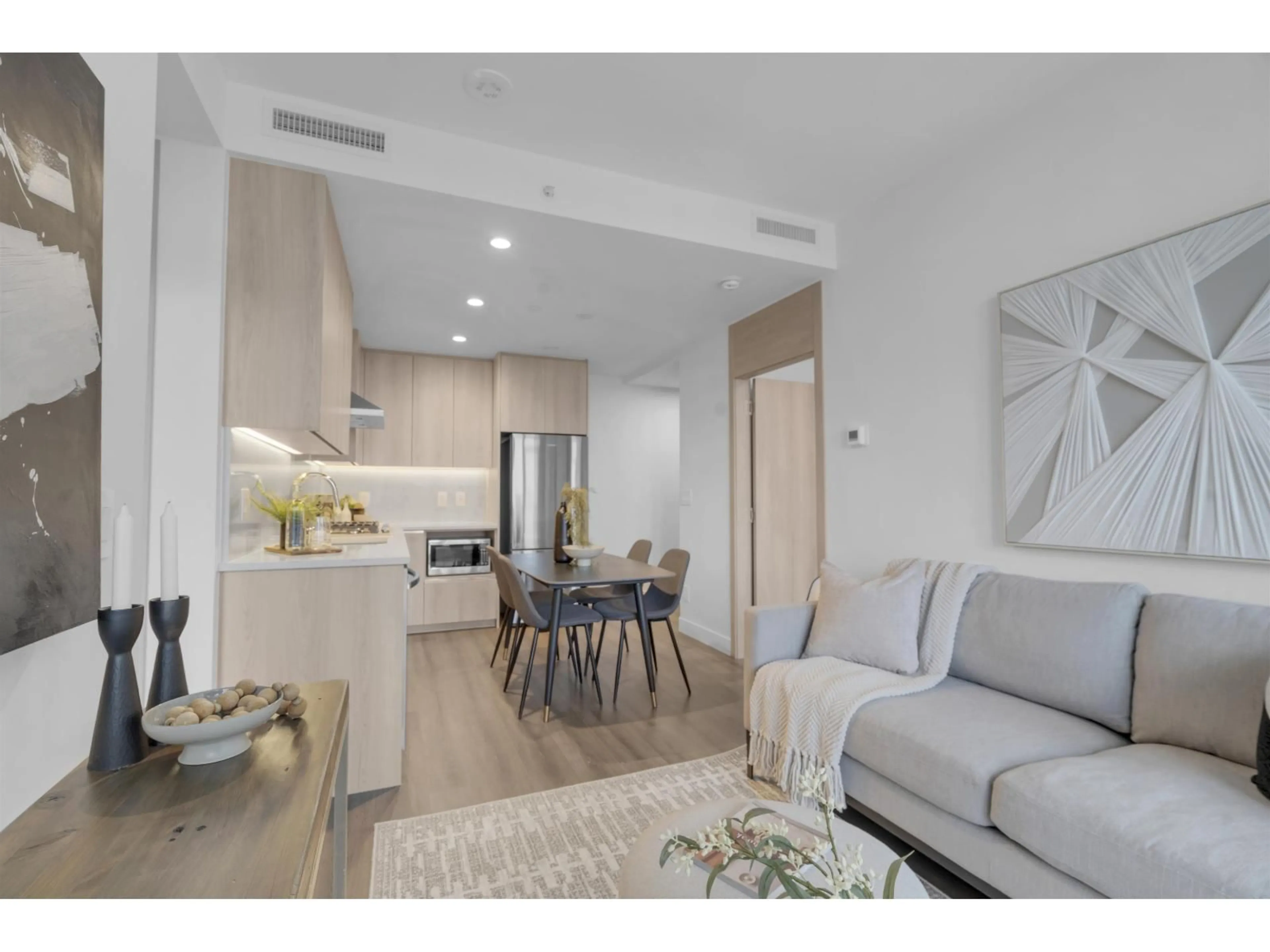 Living room with furniture, wood/laminate floor for 2405 - 10750 135A STREET, Surrey British Columbia V3T0V4