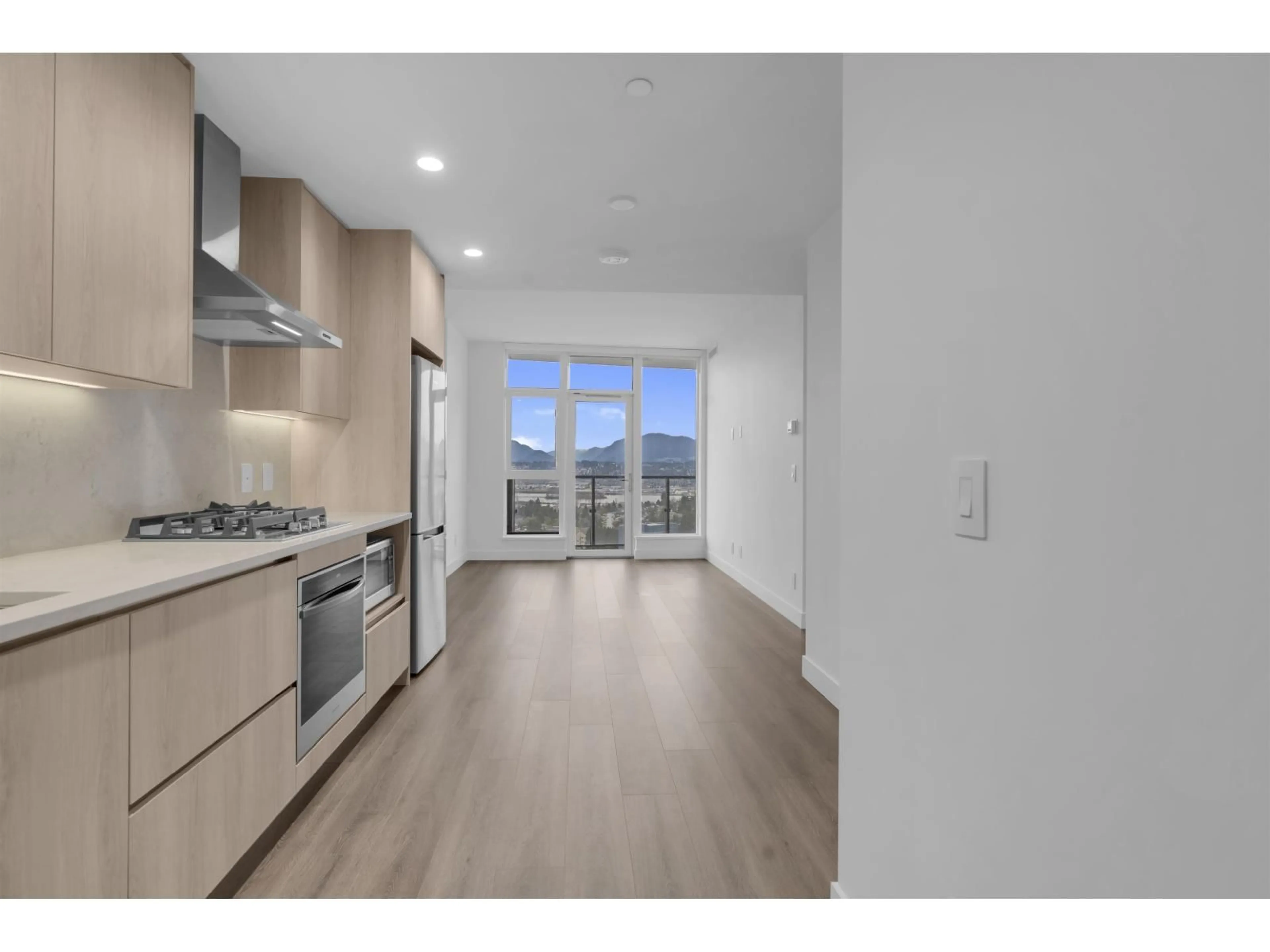 Open concept kitchen, wood/laminate floor for 1709 - 10750 135A STREET, Surrey British Columbia V3T0V4