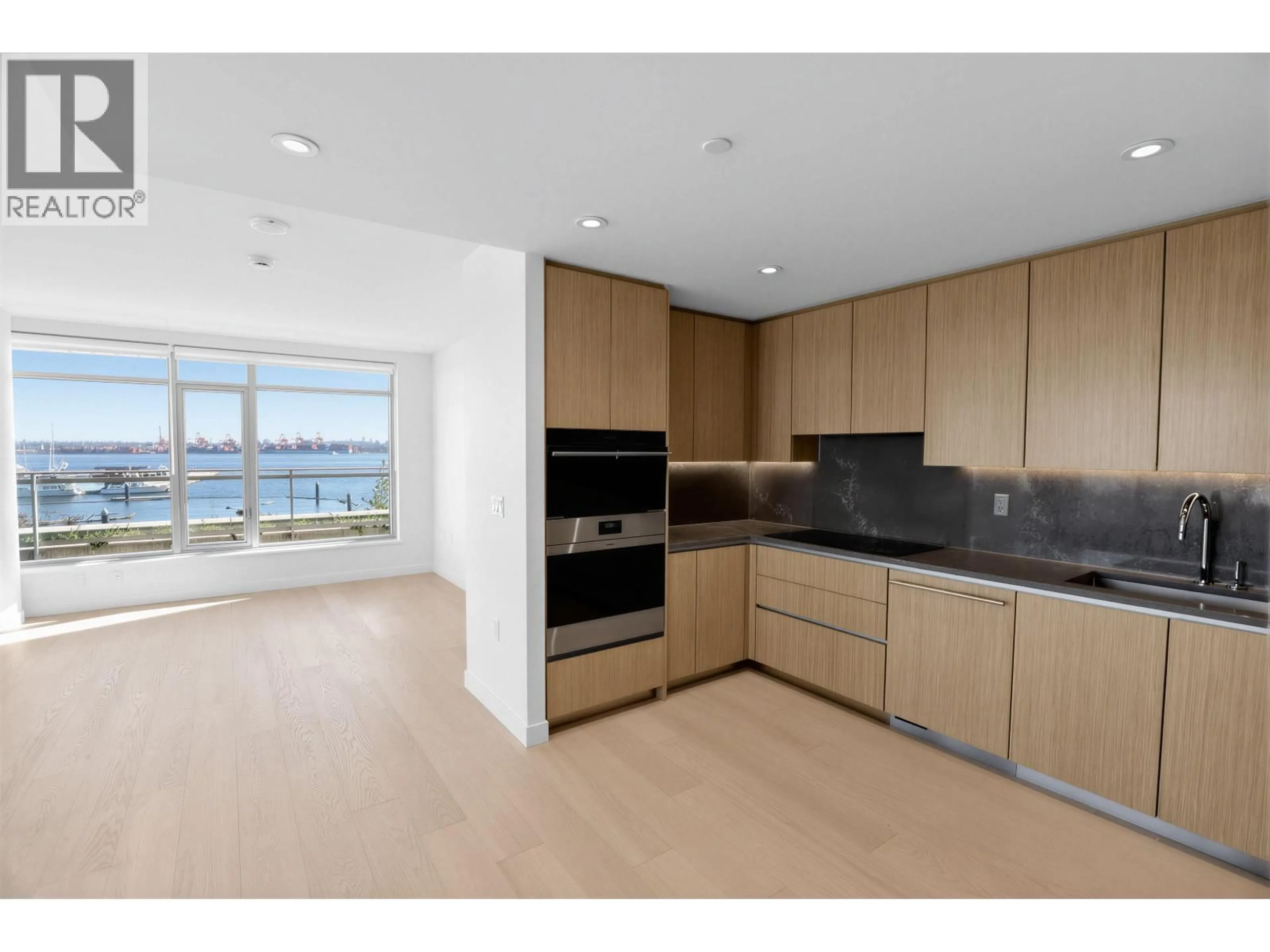 Open concept kitchen, unknown for 308 - 785 HARBOUR WAY, North Vancouver British Columbia V7P0G3