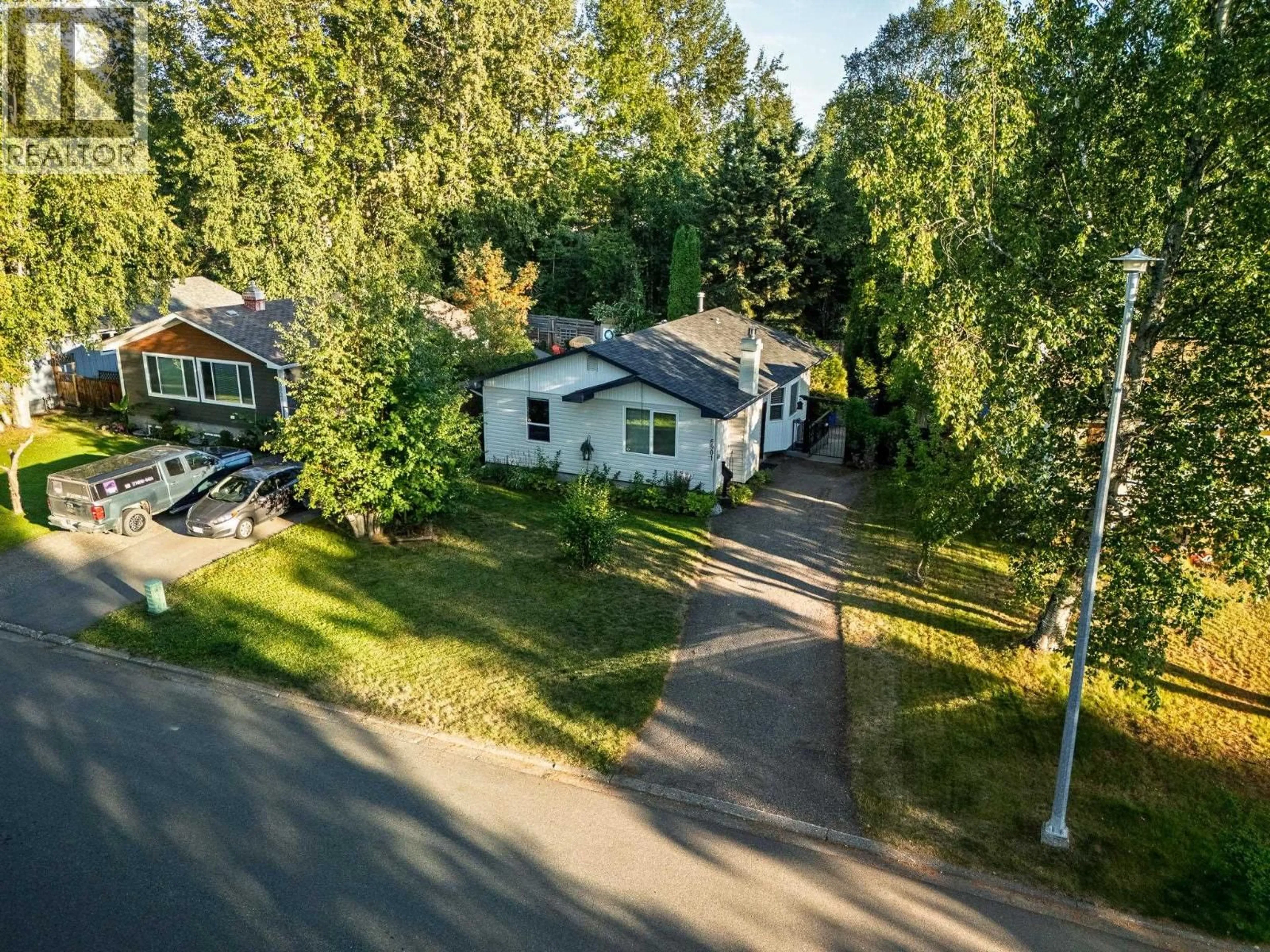 A pic from outside/outdoor area/front of a property/back of a property/a pic from drone, street for 6901 FAIRMONT CRESCENT, Prince George British Columbia V2N2P7
