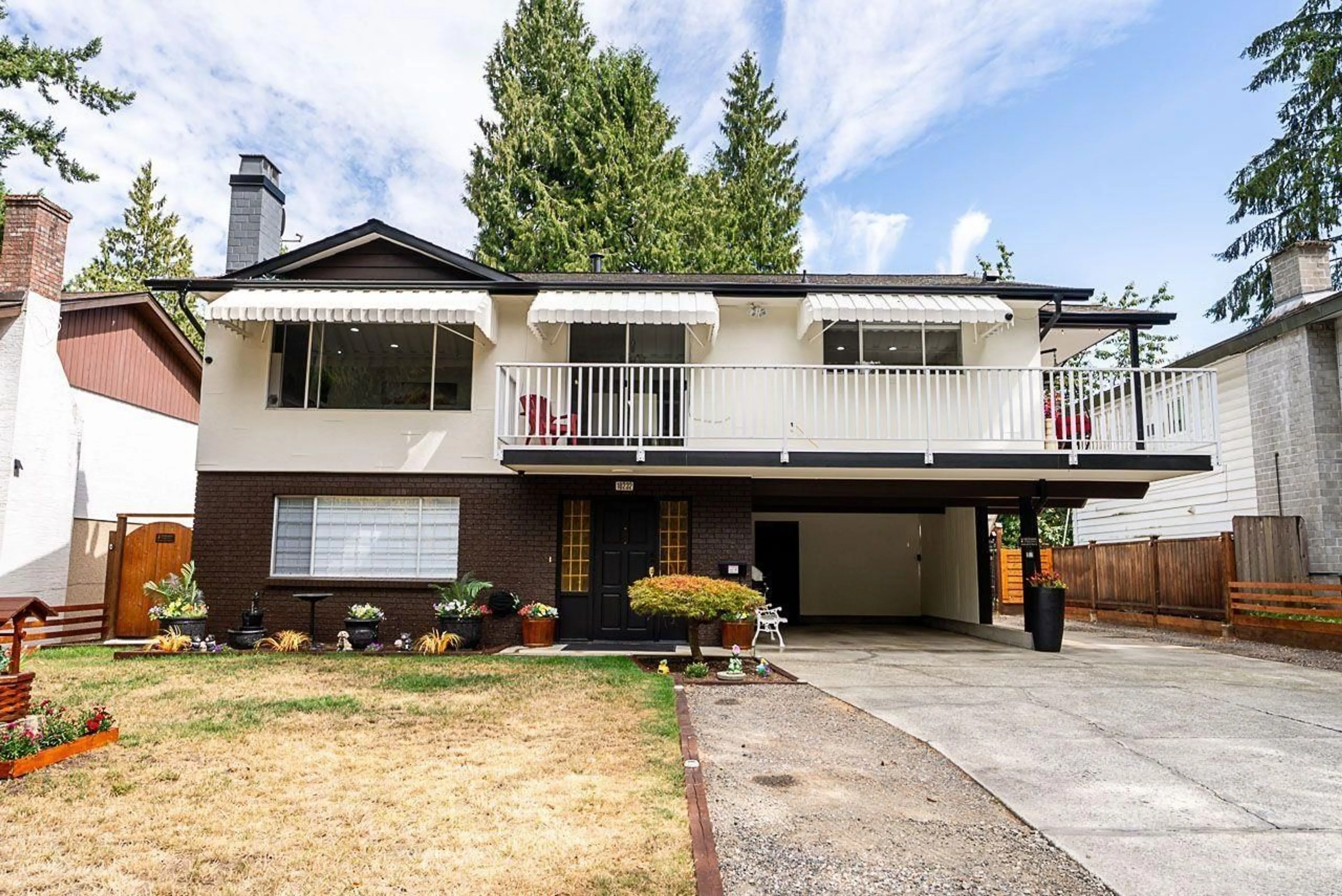 Home with vinyl exterior material, street for 10232 142A STREET, Surrey British Columbia V3T4Z7
