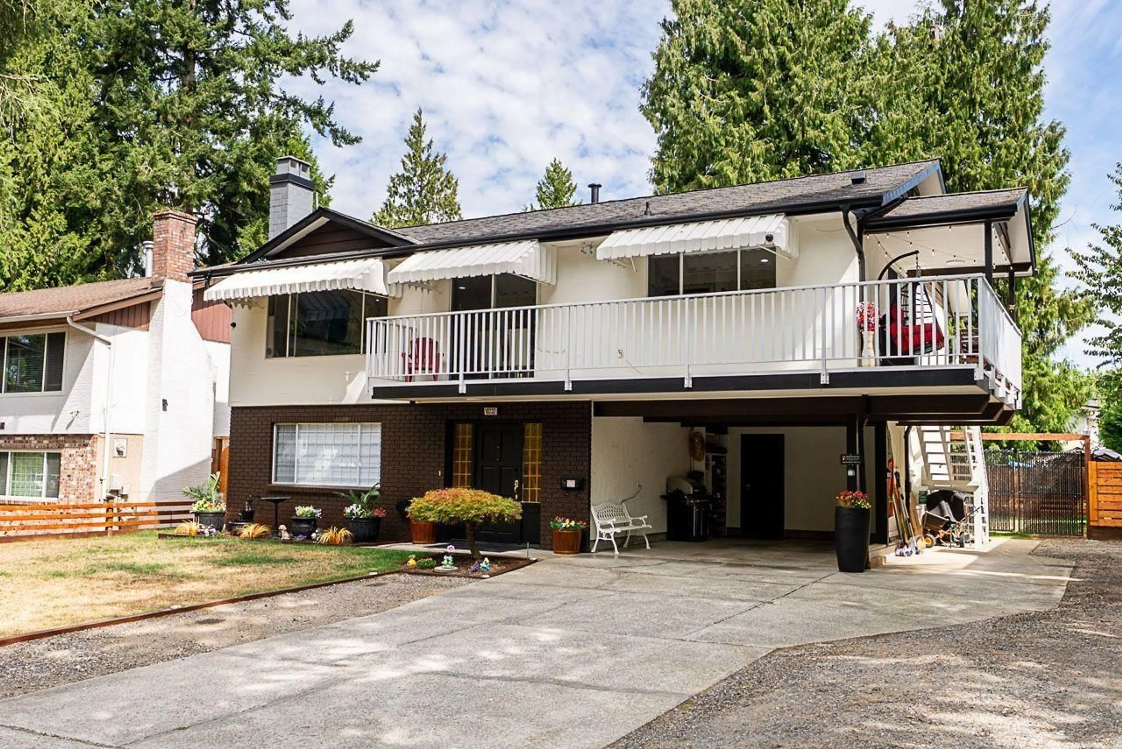 Home with vinyl exterior material, street for 10232 142A STREET, Surrey British Columbia V3T4Z7