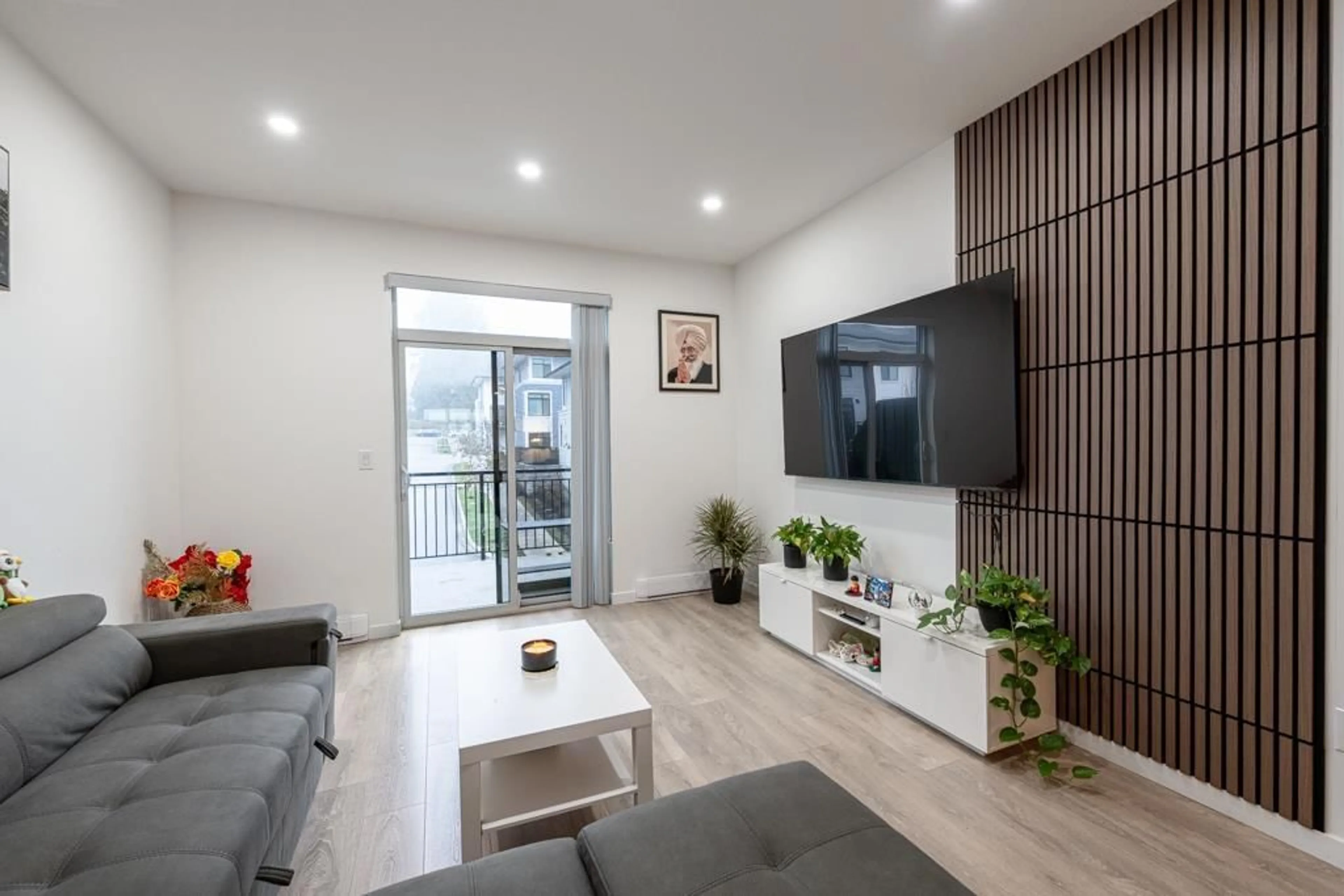 Living room with furniture, wood/laminate floor for 109 - 15235 SITKA DRIVE, Surrey British Columbia V3S0A9