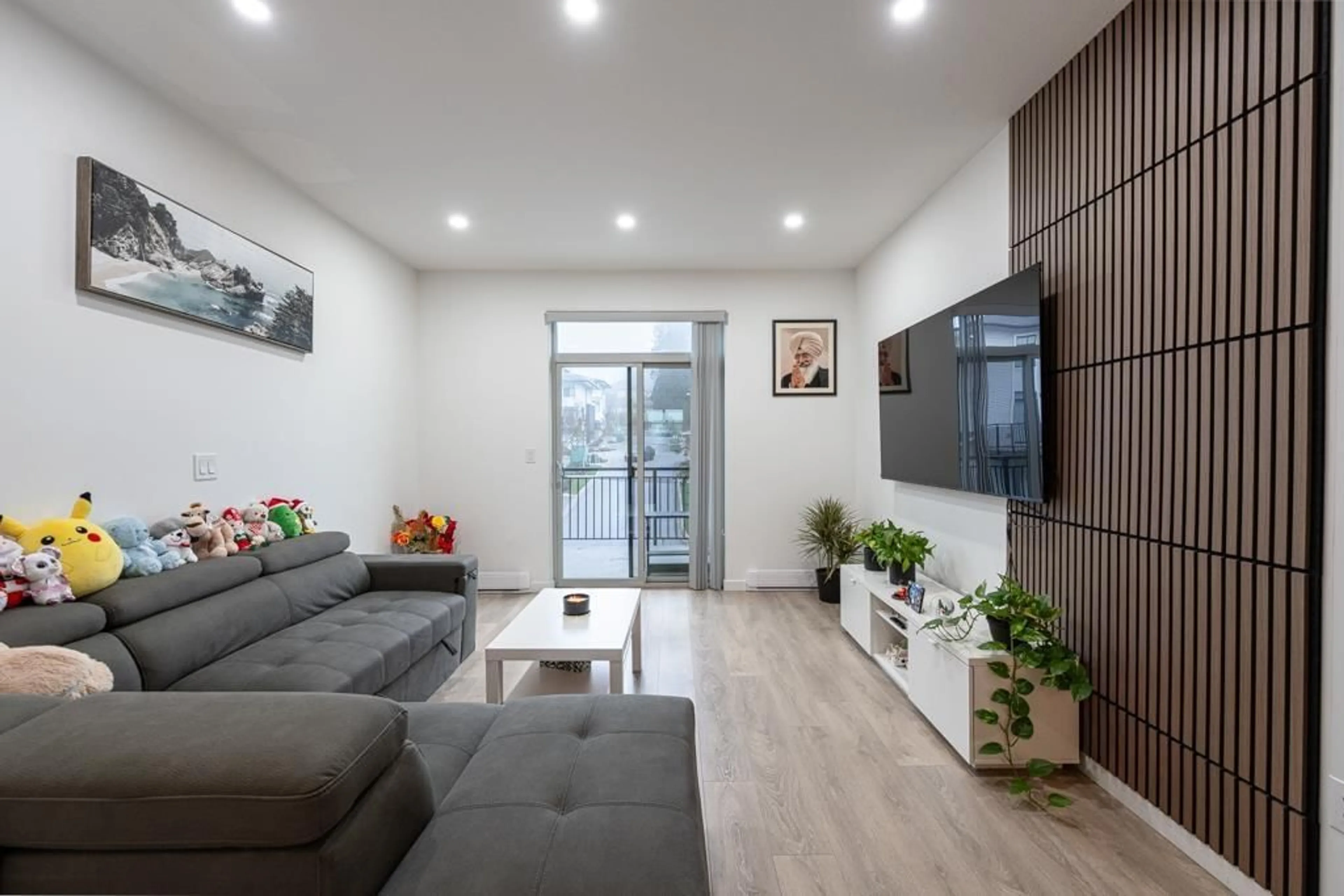 Living room with furniture, wood/laminate floor for 109 - 15235 SITKA DRIVE, Surrey British Columbia V3S0A9