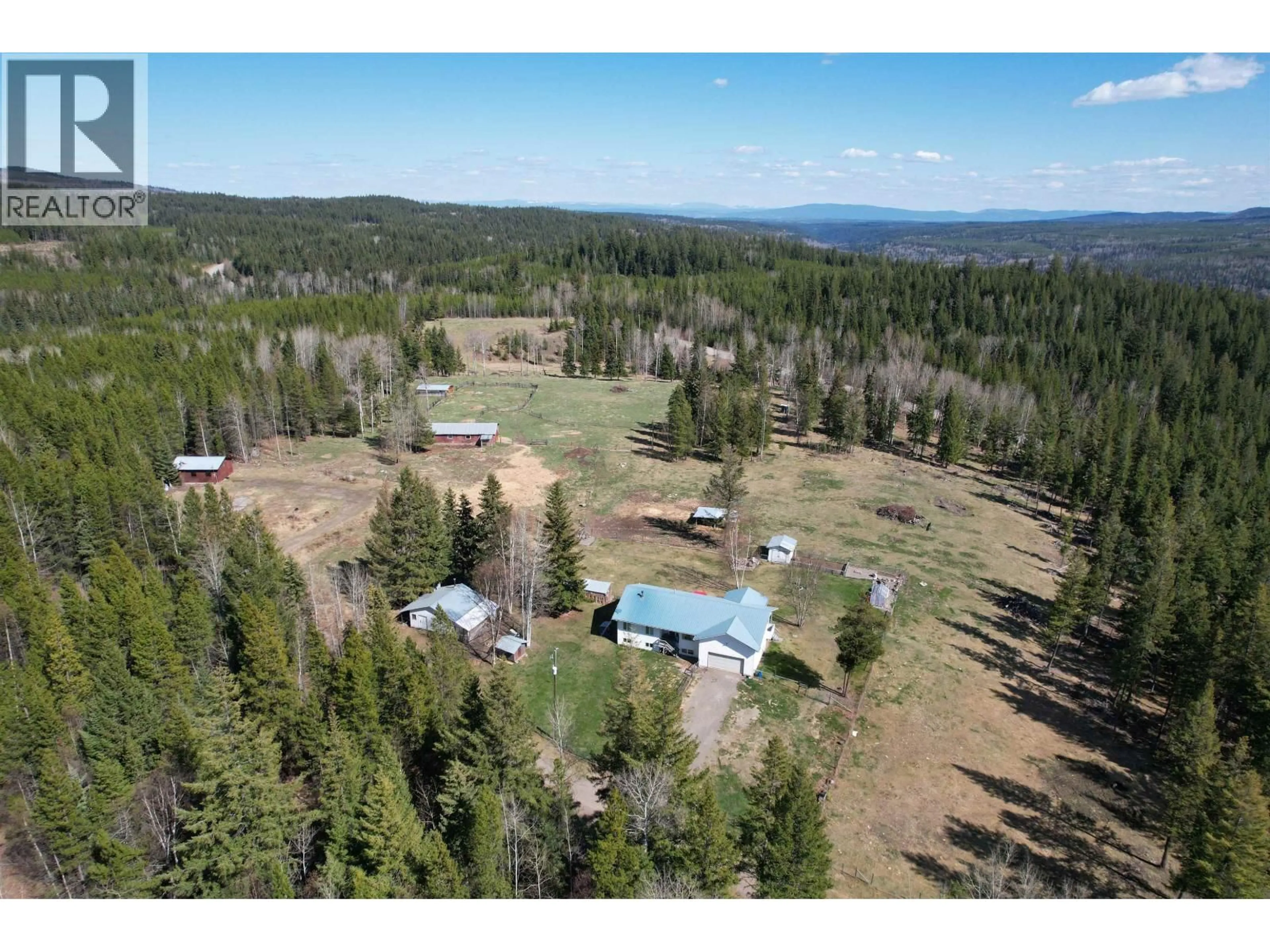 A pic from outside/outdoor area/front of a property/back of a property/a pic from drone, forest/trees view for 4006 BLUESTONE ROAD, Quesnel British Columbia V2J3H9