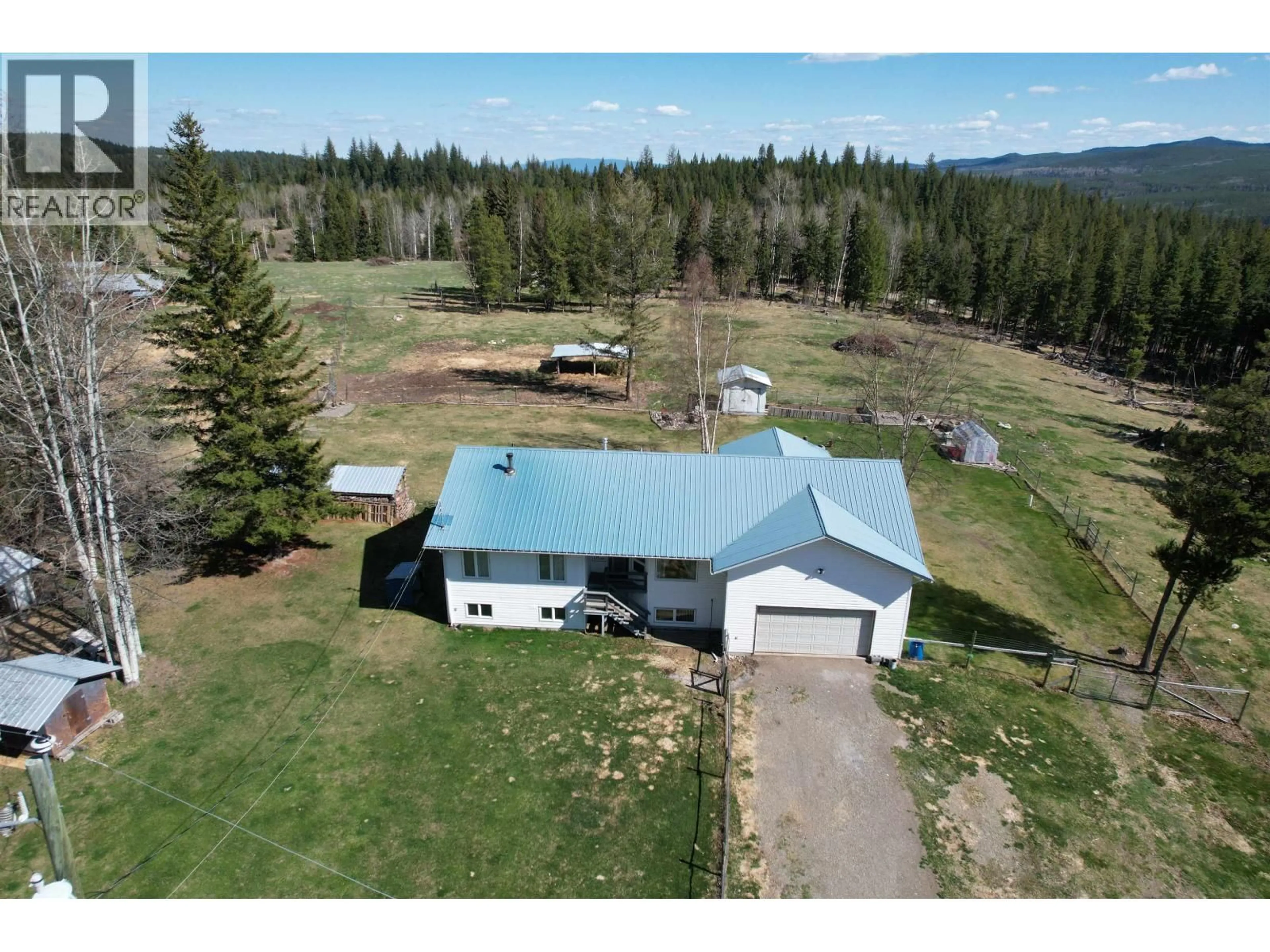 A pic from outside/outdoor area/front of a property/back of a property/a pic from drone, mountain view for 4006 BLUESTONE ROAD, Quesnel British Columbia V2J3H9