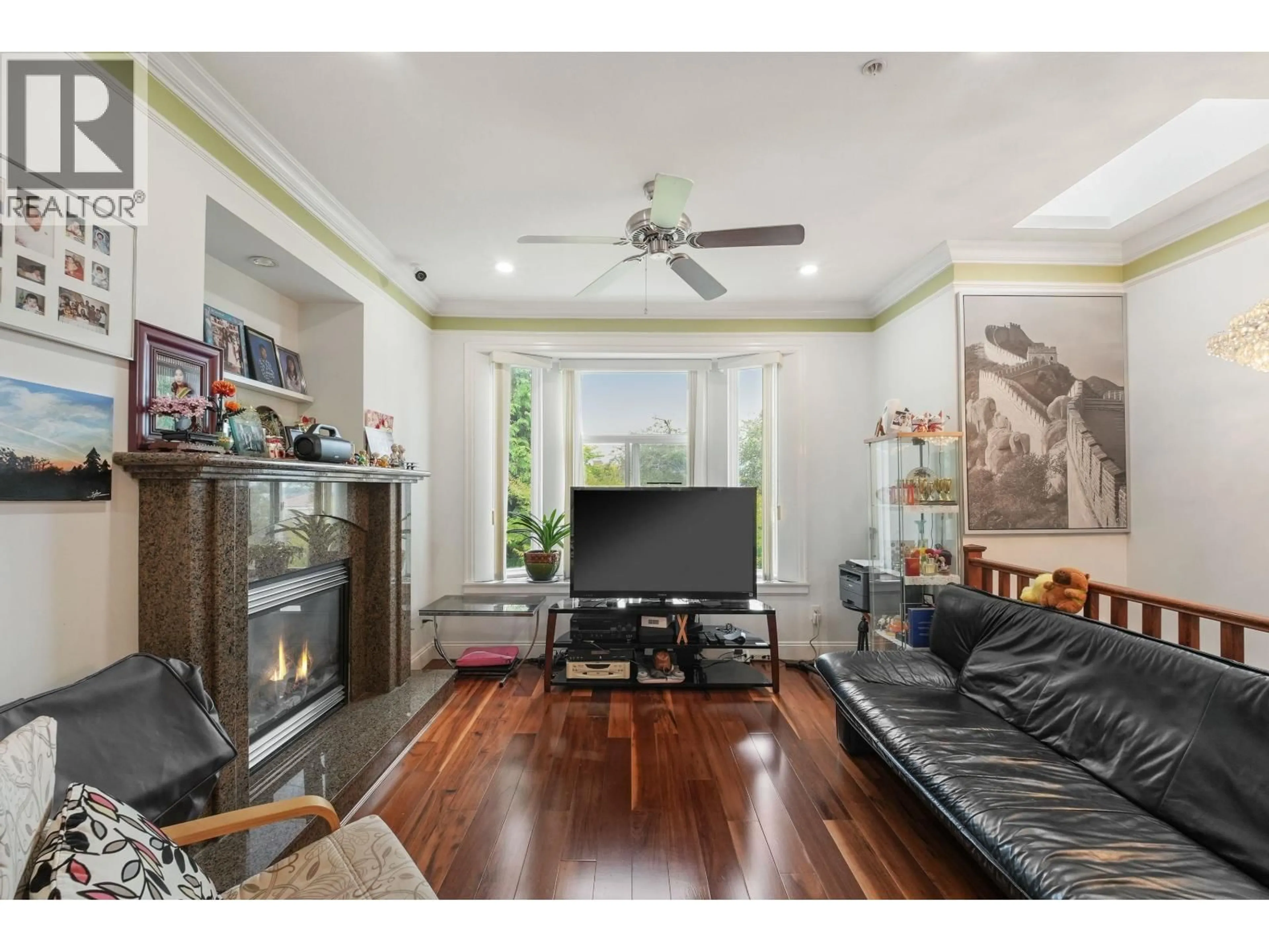 Living room with furniture, wood/laminate floor for 3054 E 5TH AVENUE AVENUE, Vancouver British Columbia V5M1N8