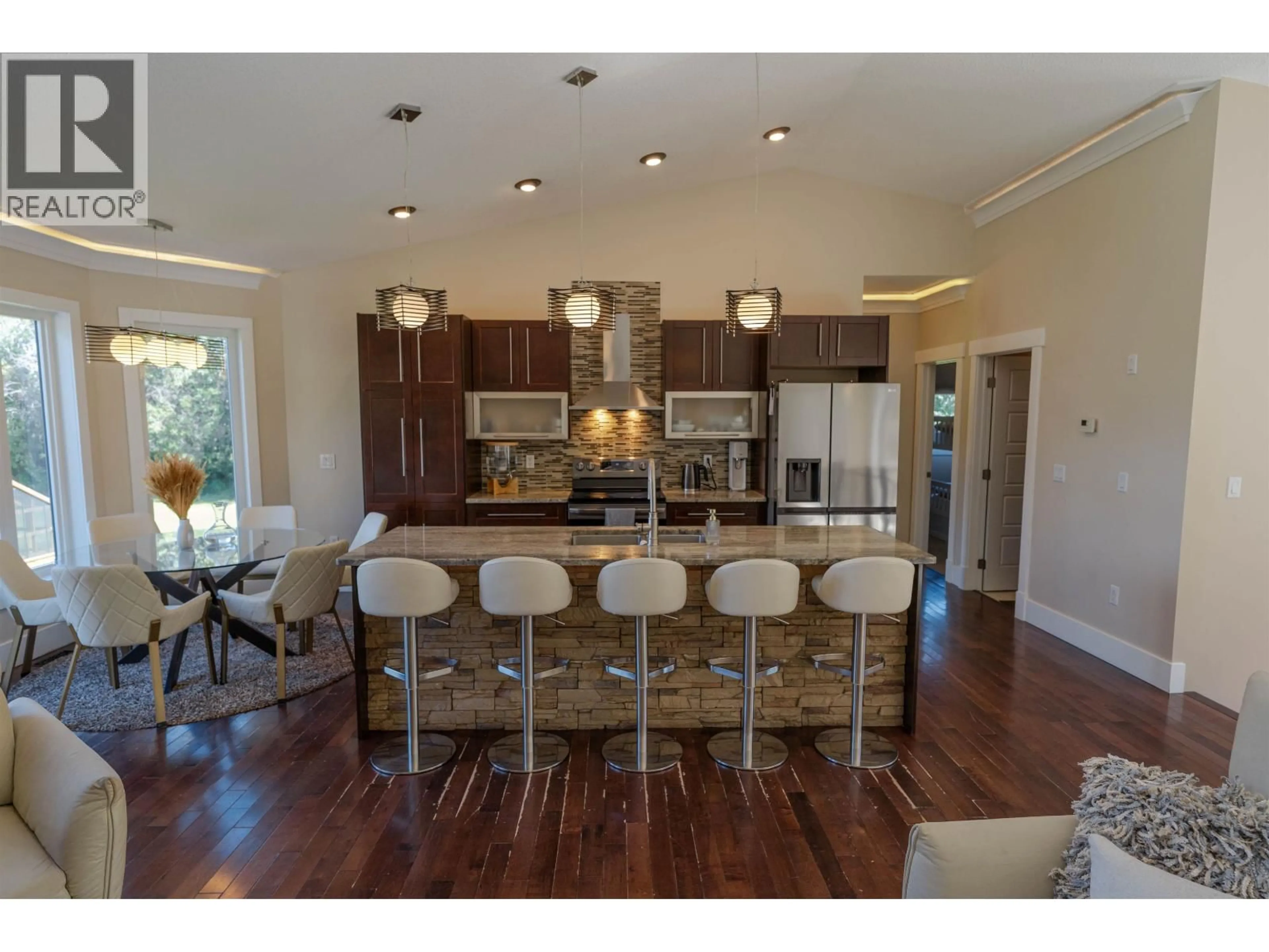 Open concept kitchen, wood/laminate floor for 13609 BLUEJAY STREET, Fort St. John British Columbia V0C1H0