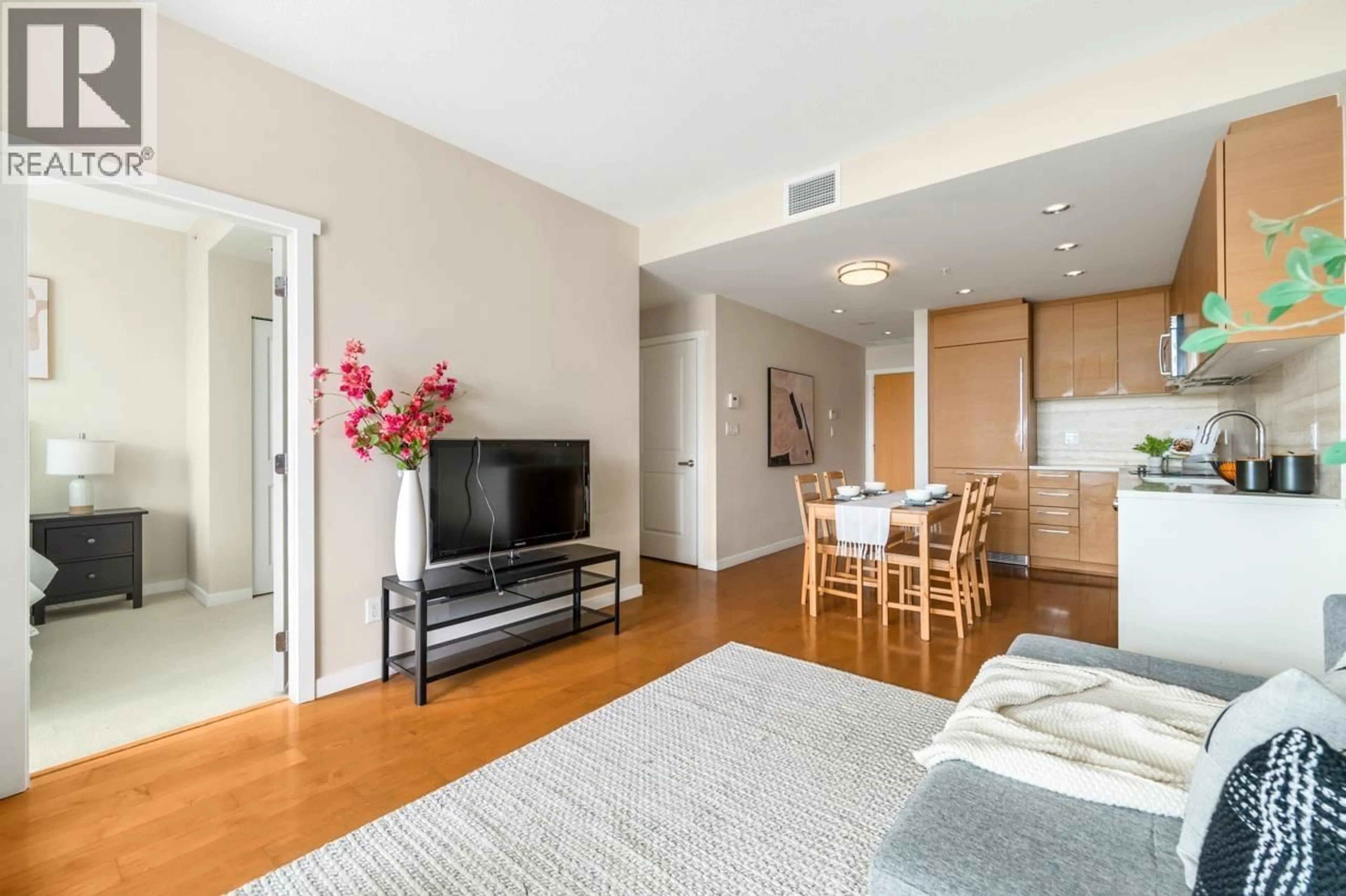 Living room with furniture, wood/laminate floor for 1503 - 5728 BERTON AVENUE, Vancouver British Columbia V6S0E5