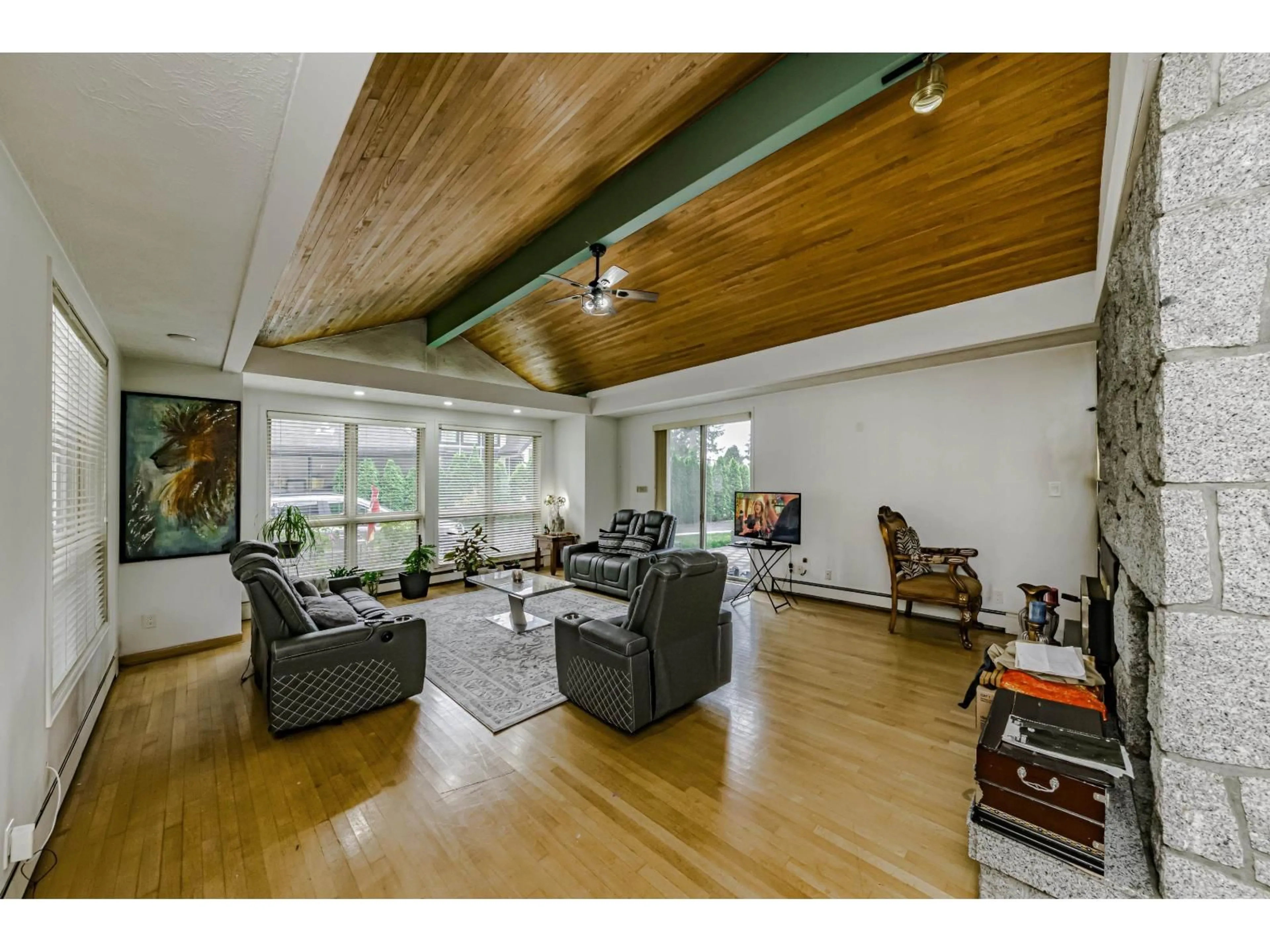 Living room with furniture, wood/laminate floor for 13439 56 AVENUE, Surrey British Columbia V3X2Z5