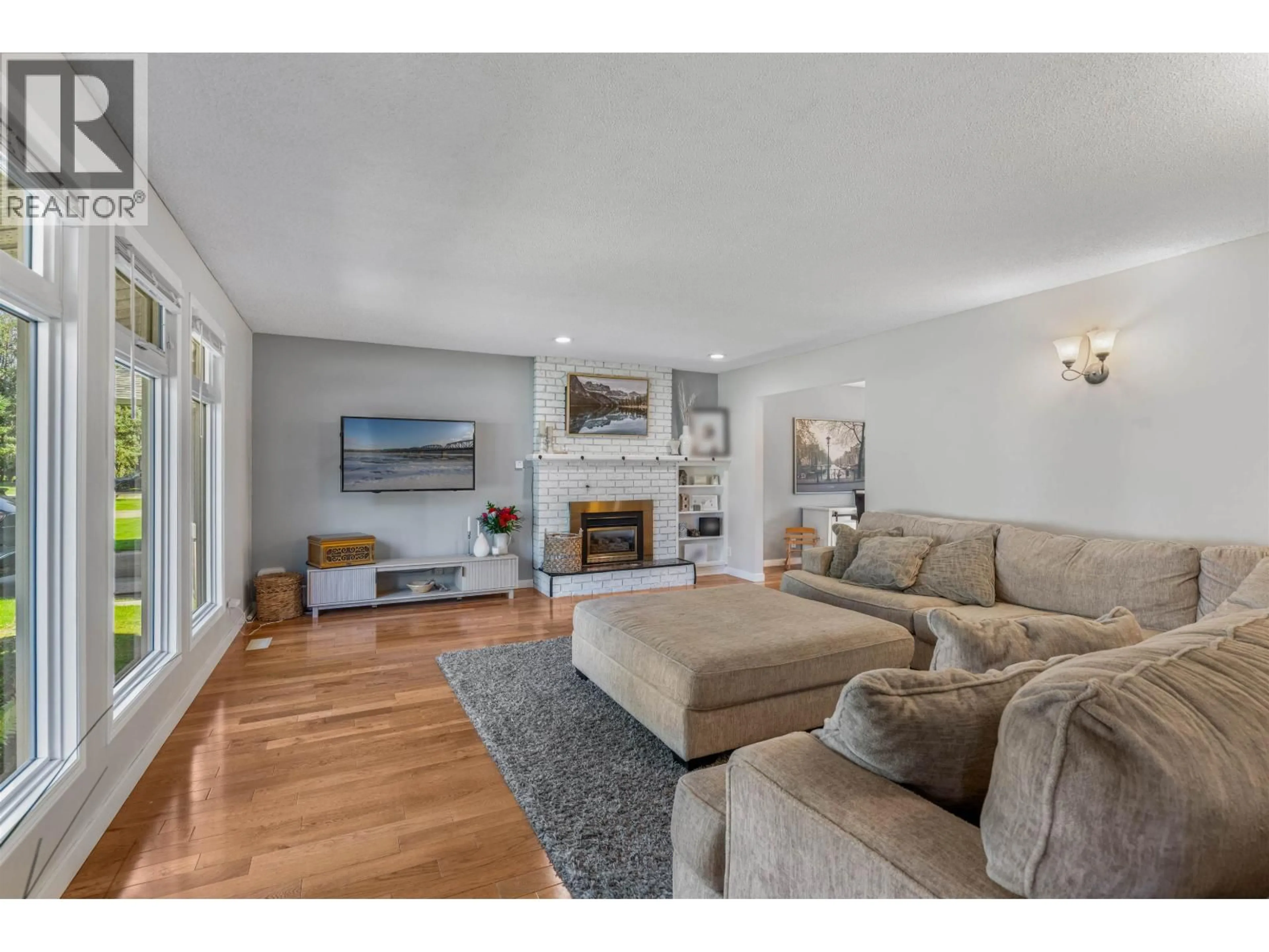 Living room with furniture, wood/laminate floor for 5680 MORIARTY CRESCENT, Prince George British Columbia V2N3X3